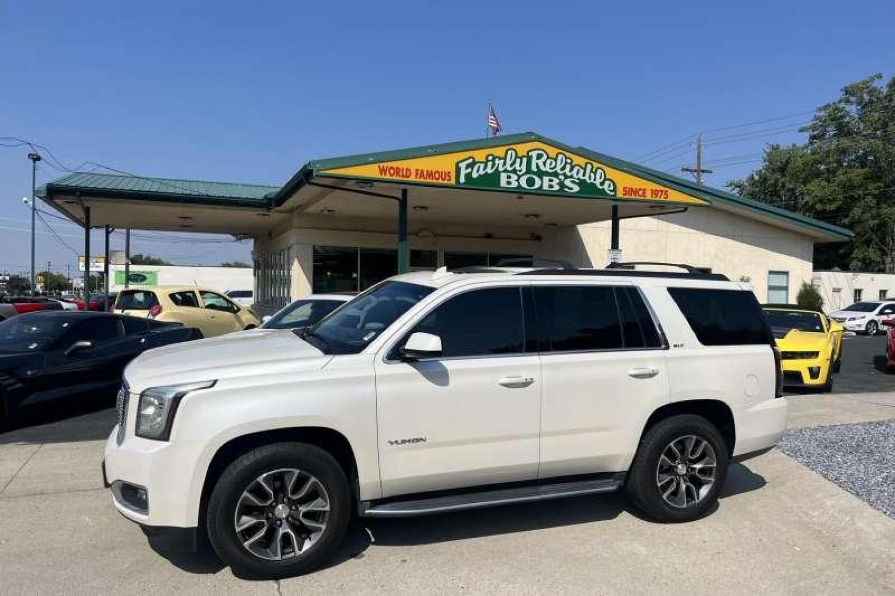 2015 Pearl White /Black GMC Yukon SLT (1GKS2BKC4FR) with an V8 5.3 Liter engine, Automatic transmission, located at 2304 W. Main St., Boise, ID, 83702, (208) 342-7777, 43.622105, -116.218658 - Financing Available O.A.C. - Photo #0