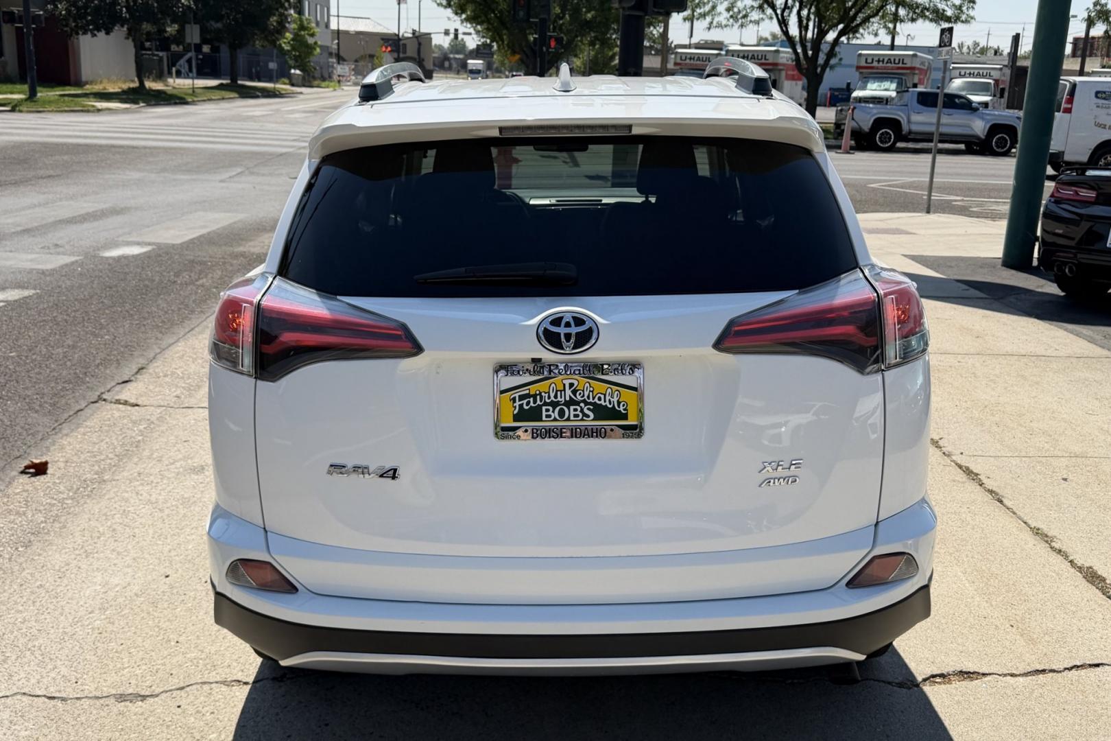2016 Super White /Black Toyota RAV4 XLE (2T3RFREV3GW) with an 4 Cyl 2.5 Liter engine, Automatic transmission, located at 2304 W. Main St., Boise, ID, 83702, (208) 342-7777, 43.622105, -116.218658 - Sunroof! Clean And Ready To Go!- Photo#1