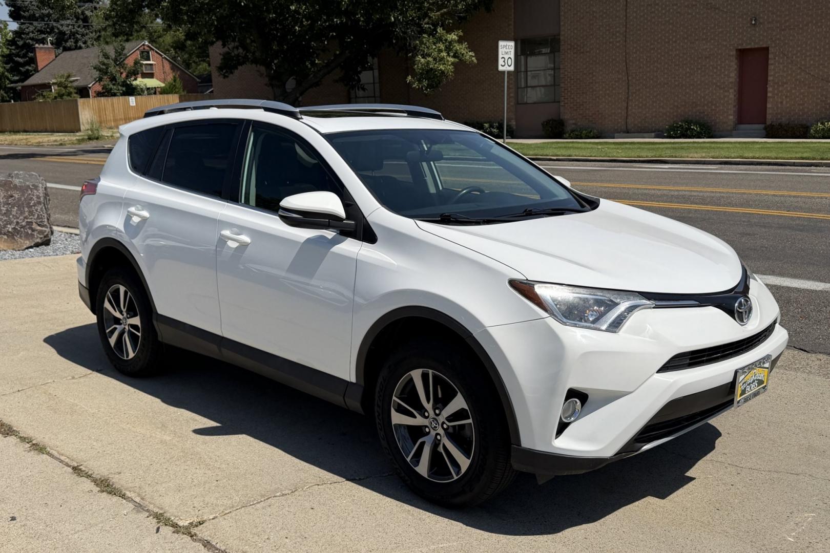 2016 Super White /Black Toyota RAV4 XLE (2T3RFREV3GW) with an 4 Cyl 2.5 Liter engine, Automatic transmission, located at 2304 W. Main St., Boise, ID, 83702, (208) 342-7777, 43.622105, -116.218658 - Sunroof! Clean And Ready To Go!- Photo#2