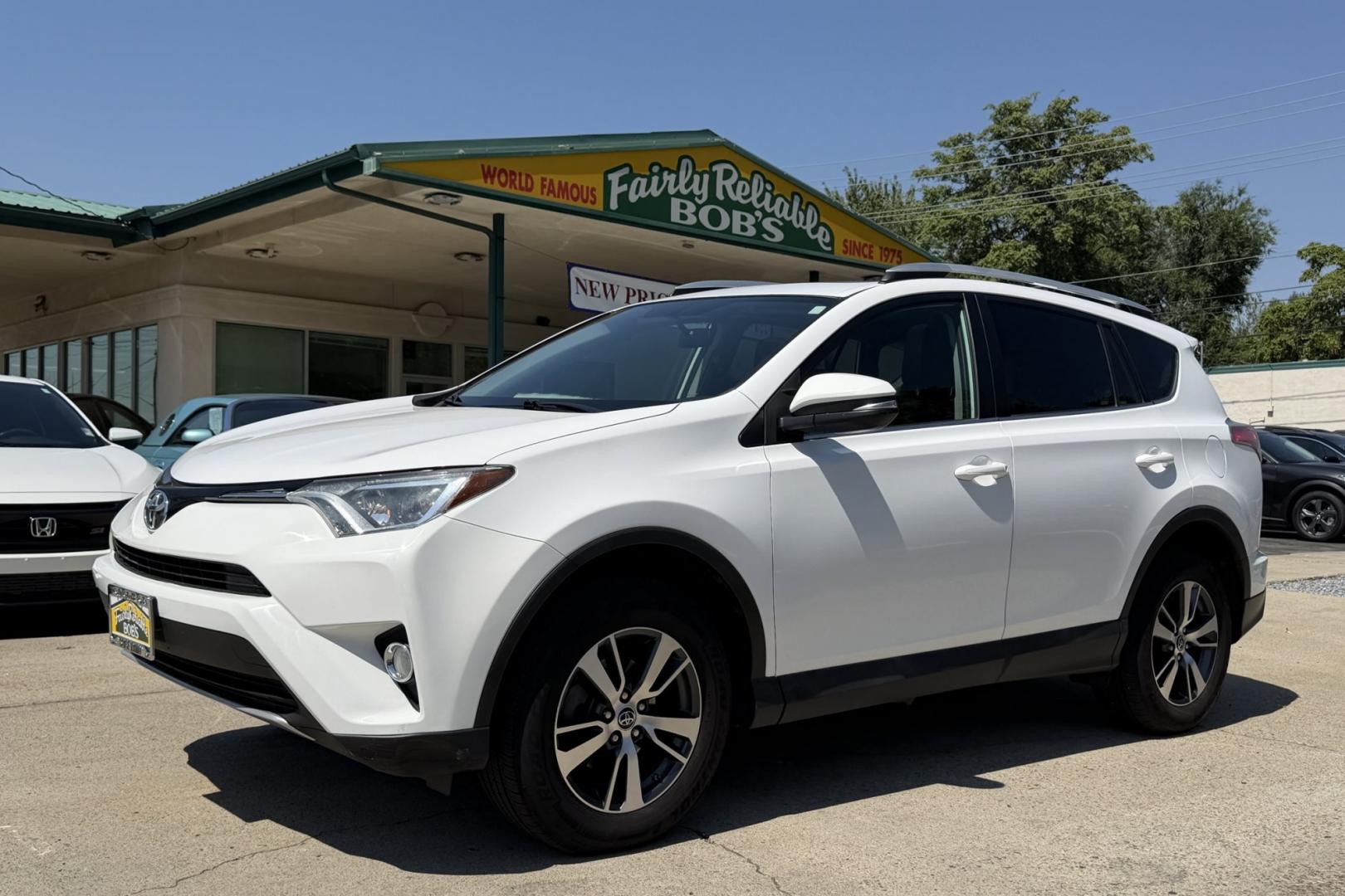2016 Super White /Black Toyota RAV4 XLE (2T3RFREV3GW) with an 4 Cyl 2.5 Liter engine, Automatic transmission, located at 2304 W. Main St., Boise, ID, 83702, (208) 342-7777, 43.622105, -116.218658 - Sunroof! Clean And Ready To Go!- Photo#0