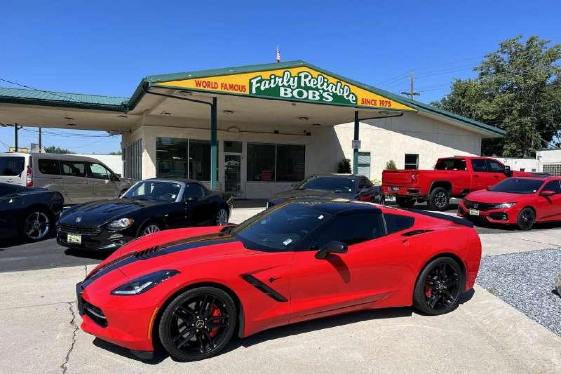2015 Torch Red /Black Chevrolet Corvette Stingray 2LT Z51 Coupe (1G1YK2D78F5) with an V8 6.2 Liter engine, Automatic transmission, located at 2304 W. Main St., Boise, ID, 83702, (208) 342-7777, 43.622105, -116.218658 - Super low mileage Z51 coupe in stunning Torch Red! - Photo #0