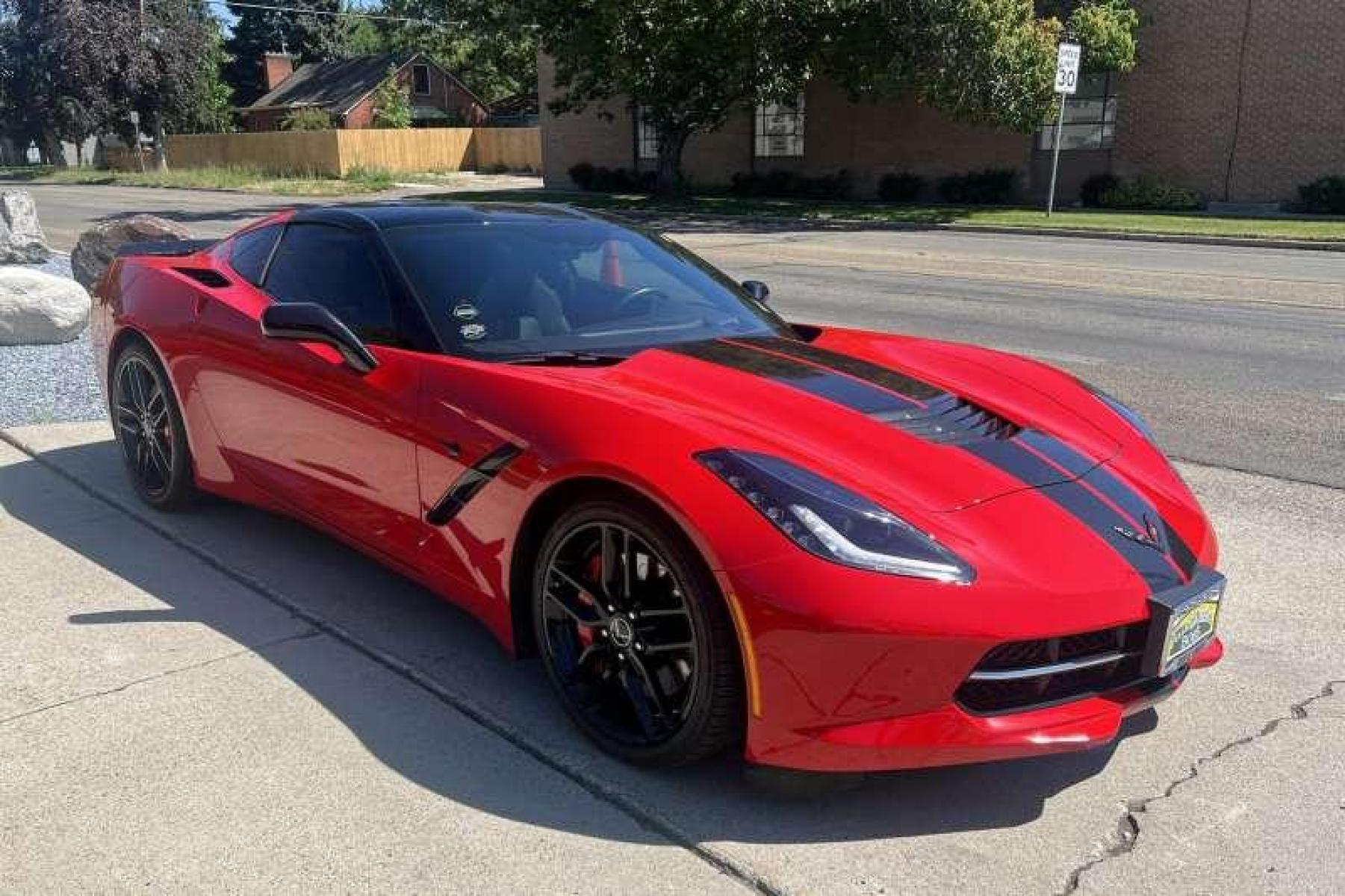 2015 Torch Red /Black Chevrolet Corvette Stingray 2LT Z51 Coupe (1G1YK2D78F5) with an V8 6.2 Liter engine, Automatic transmission, located at 2304 W. Main St., Boise, ID, 83702, (208) 342-7777, 43.622105, -116.218658 - Super low mileage Z51 coupe in stunning Torch Red! - Photo #2