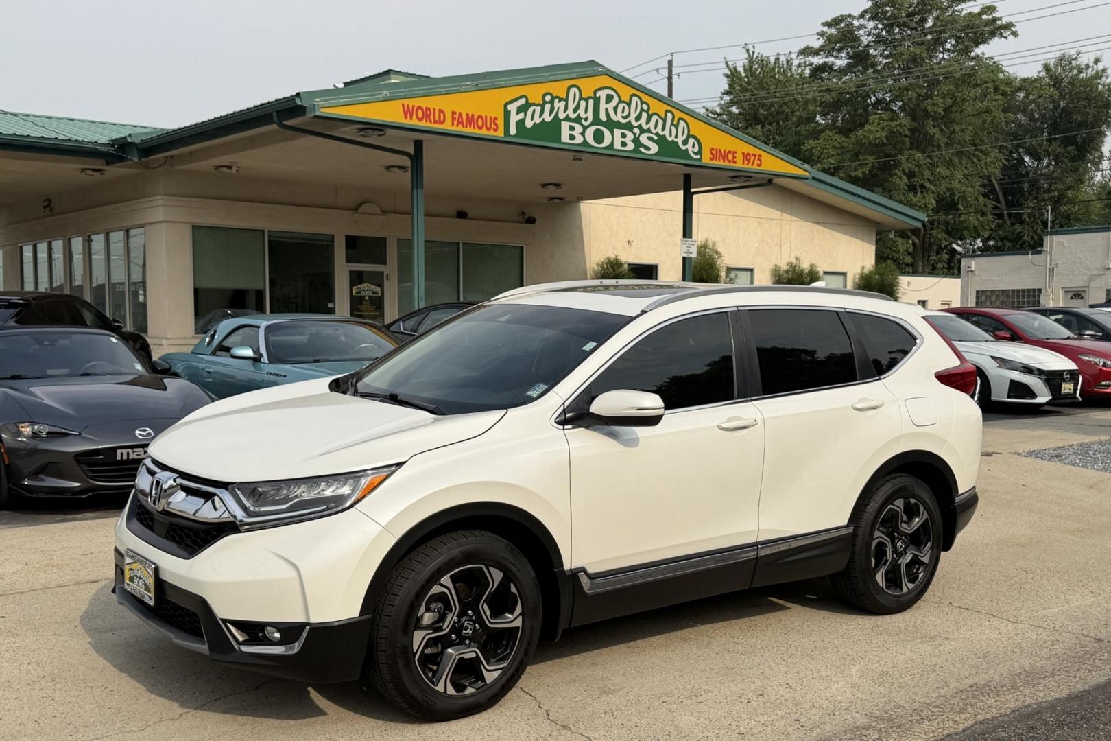 2018 White Diamond Pearl /Tan Honda CR-V Touring (2HKRW2H93JH) with an 4 Cyl 1.5 liter Turbo-Charged engine, Automatic transmission, located at 2304 W. Main St., Boise, ID, 83702, (208) 342-7777, 43.622105, -116.218658 - Highly Optioned And Clean!- Photo#0