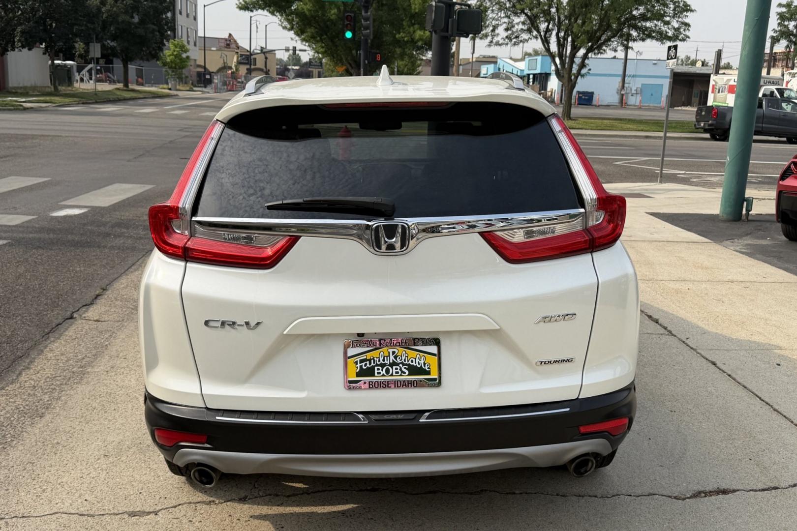2018 White Diamond Pearl /Tan Honda CR-V Touring (2HKRW2H93JH) with an 4 Cyl 1.5 liter Turbo-Charged engine, Automatic transmission, located at 2304 W. Main St., Boise, ID, 83702, (208) 342-7777, 43.622105, -116.218658 - Highly Optioned And Clean!- Photo#1