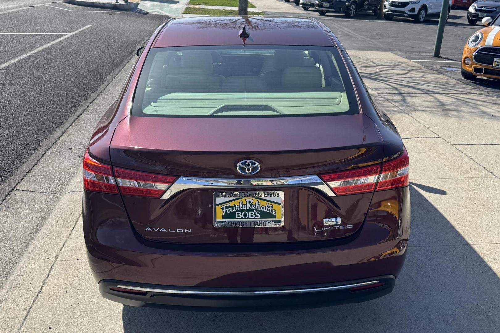 2015 Ooh La La Rouge Mica Red /Almond Toyota Avalon Hybrid Limited (4T1BD1EBXFU) with an 4 Cyl 2.5 Liter Hybrid engine, Automatic transmission, located at 2304 W. Main St., Boise, ID, 83702, (208) 342-7777, 43.622105, -116.218658 - Low miles! Well equipped! - Photo#1