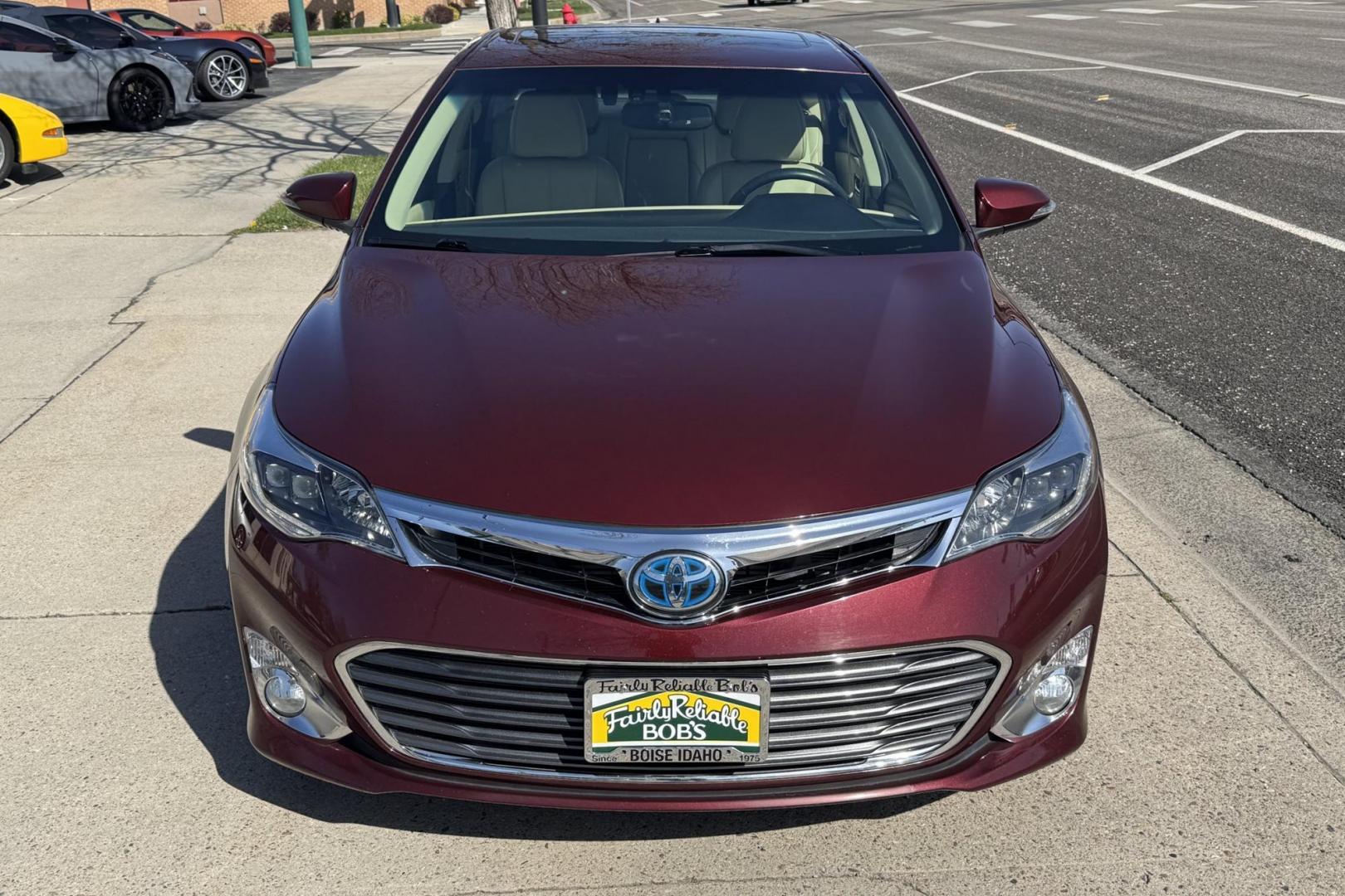 2015 Ooh La La Rouge Mica Red /Almond Toyota Avalon Hybrid Limited (4T1BD1EBXFU) with an 4 Cyl 2.5 Liter Hybrid engine, Automatic transmission, located at 2304 W. Main St., Boise, ID, 83702, (208) 342-7777, 43.622105, -116.218658 - Low miles! Well equipped! - Photo#3