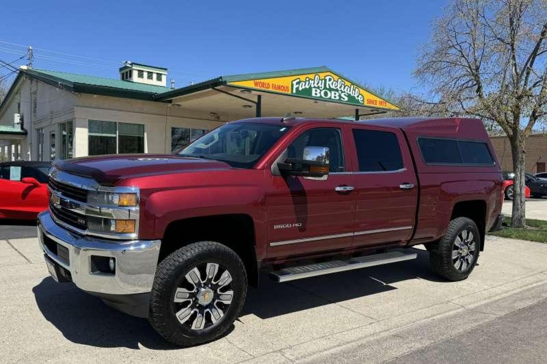 2015 Deep Ruby Metallic /Oak Chevrolet Silverado 2500 HD Crew Cab LTZ (1GC1KWEG2FF) with an V8 6.0 Liter engine, Automatic transmission, located at 2304 W. Main St., Boise, ID, 83702, (208) 342-7777, 43.622105, -116.218658 - New Wheels And Tires! Matching High Roof Shell! Well Maintained And Clean! - Photo #0