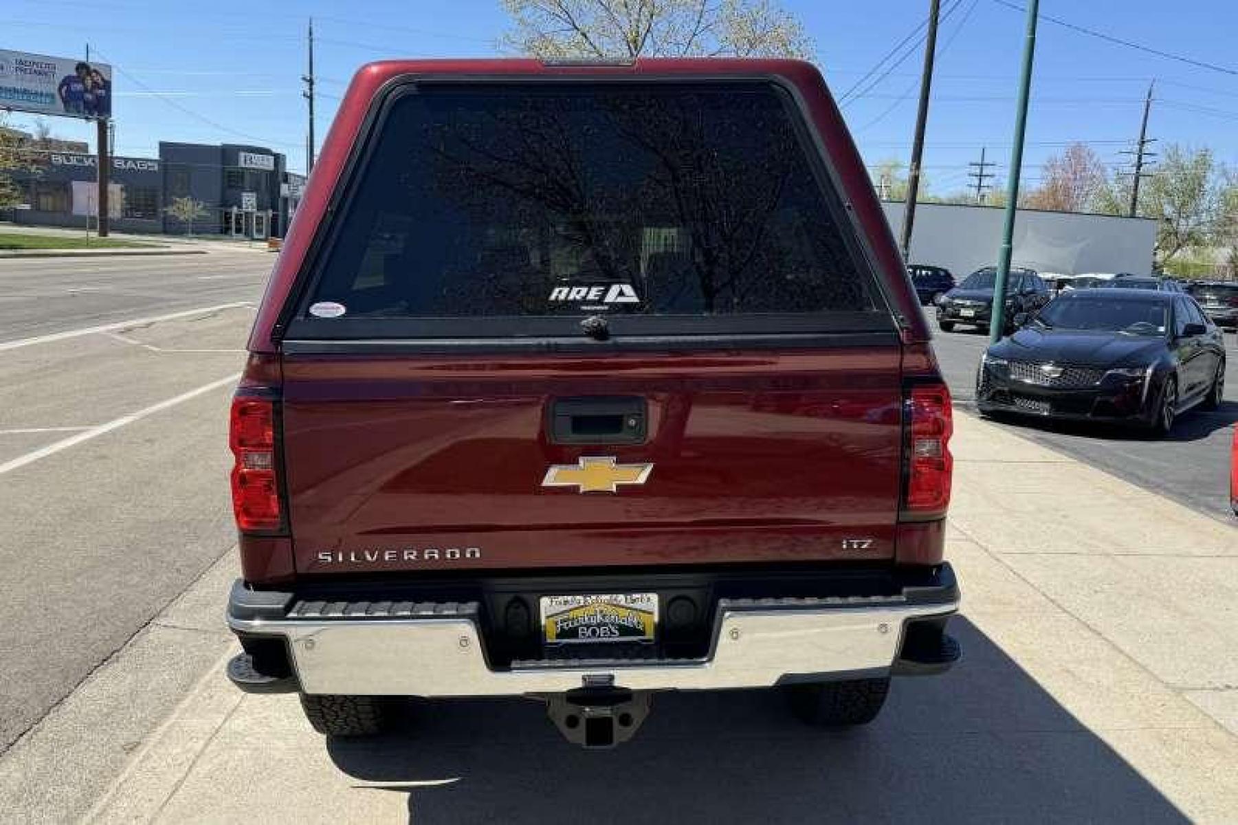 2015 Deep Ruby Metallic /Oak Chevrolet Silverado 2500 HD Crew Cab LTZ (1GC1KWEG2FF) with an V8 6.0 Liter engine, Automatic transmission, located at 2304 W. Main St., Boise, ID, 83702, (208) 342-7777, 43.622105, -116.218658 - New Wheels And Tires! Matching High Roof Shell! Well Maintained And Clean! - Photo #1