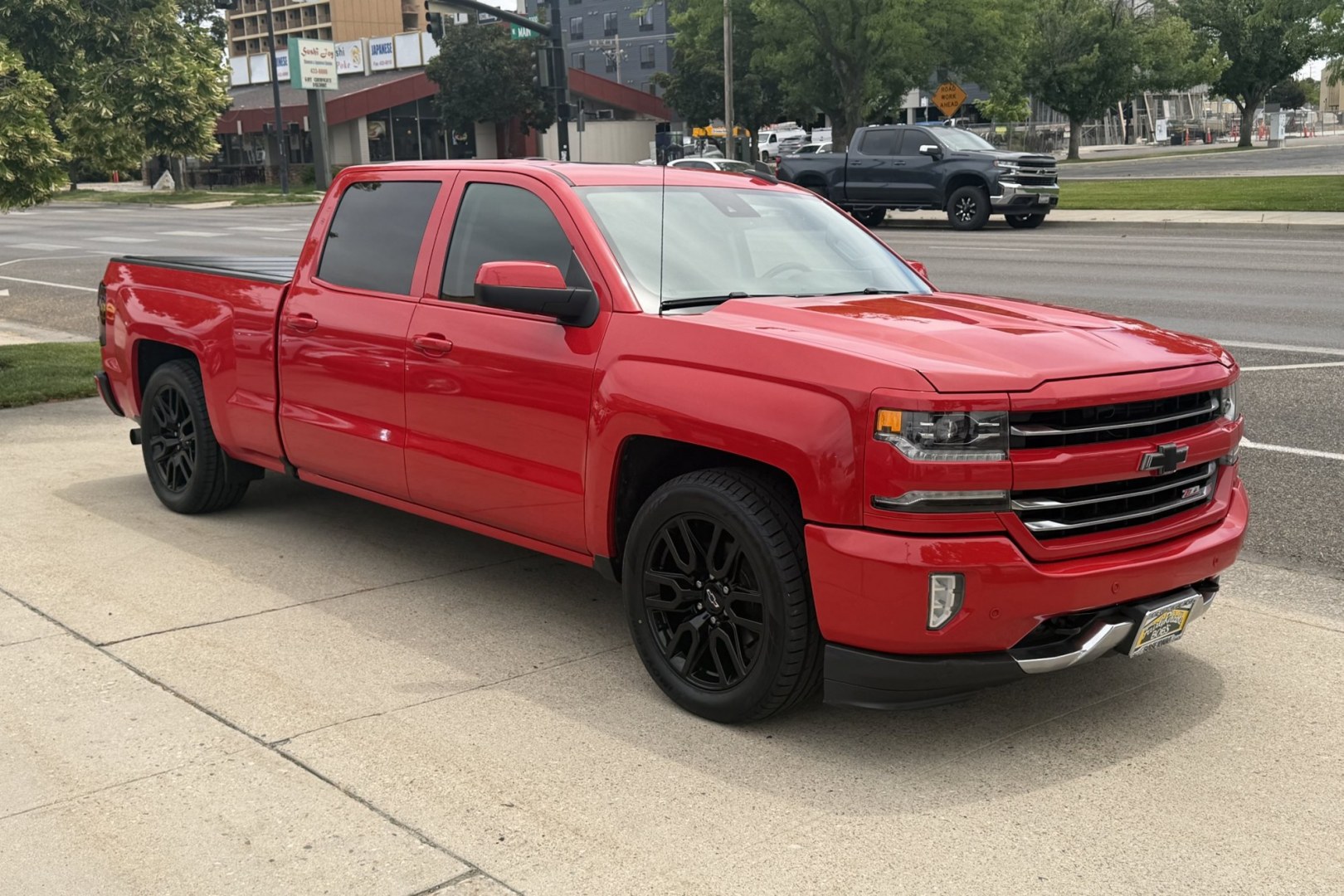 2017 Red Hot /Black Chevrolet Silverado 1500 LTZ Z71 (3GCUKSEJ3HG) with an V8 6.2 Liter engine, Automatic 6 Speed transmission, located at 2304 W. Main St., Boise, ID, 83702, (208) 342-7777, 43.622105, -116.218658 - Sharp Truck! New Tires! Factory Rear Entertainment!- Photo#2