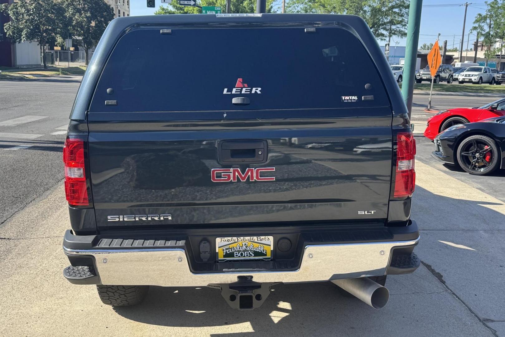 2018 Dark Slate Metallic /Black GMC Sierra 2500HD SLT (1GT12TEY5JF) with an V8 6.6 Liter Turbo Diesel engine, Automatic 6 Speed With Overdrive Allison transmission, located at 2304 W. Main St., Boise, ID, 83702, (208) 342-7777, 43.622105, -116.218658 - Low miles! Sharp Truck! - Photo#1