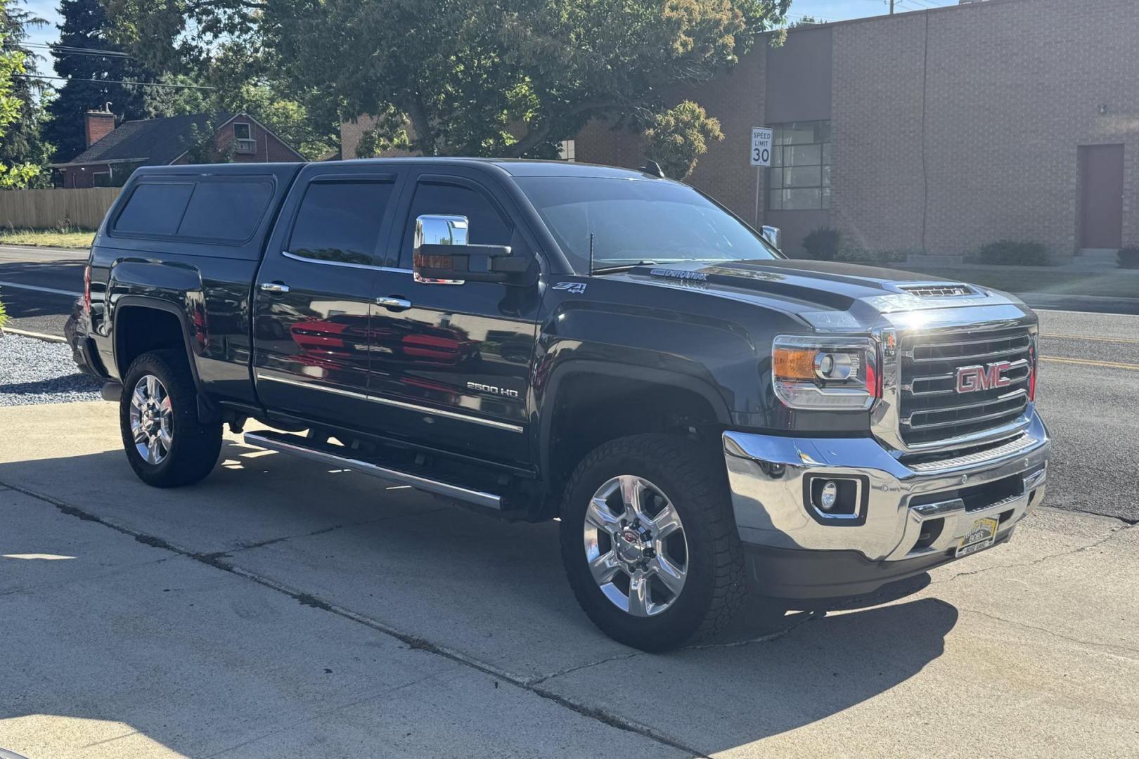 2018 Dark Slate Metallic /Black GMC Sierra 2500HD SLT (1GT12TEY5JF) with an V8 6.6 Liter Turbo Diesel engine, Automatic 6 Speed With Overdrive Allison transmission, located at 2304 W. Main St., Boise, ID, 83702, (208) 342-7777, 43.622105, -116.218658 - Low miles! Sharp Truck! - Photo#2