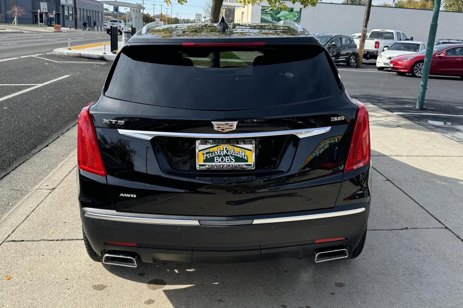 2019 Black /Black Cadillac XT5 Premium Luxury (1GYKNFRSXKZ) with an V6 3.6 Liter engine, Automatic 8 Speed transmission, located at 2304 W. Main St., Boise, ID, 83702, (208) 342-7777, 43.622105, -116.218658 - Financing Available O.A.C. - Photo#1