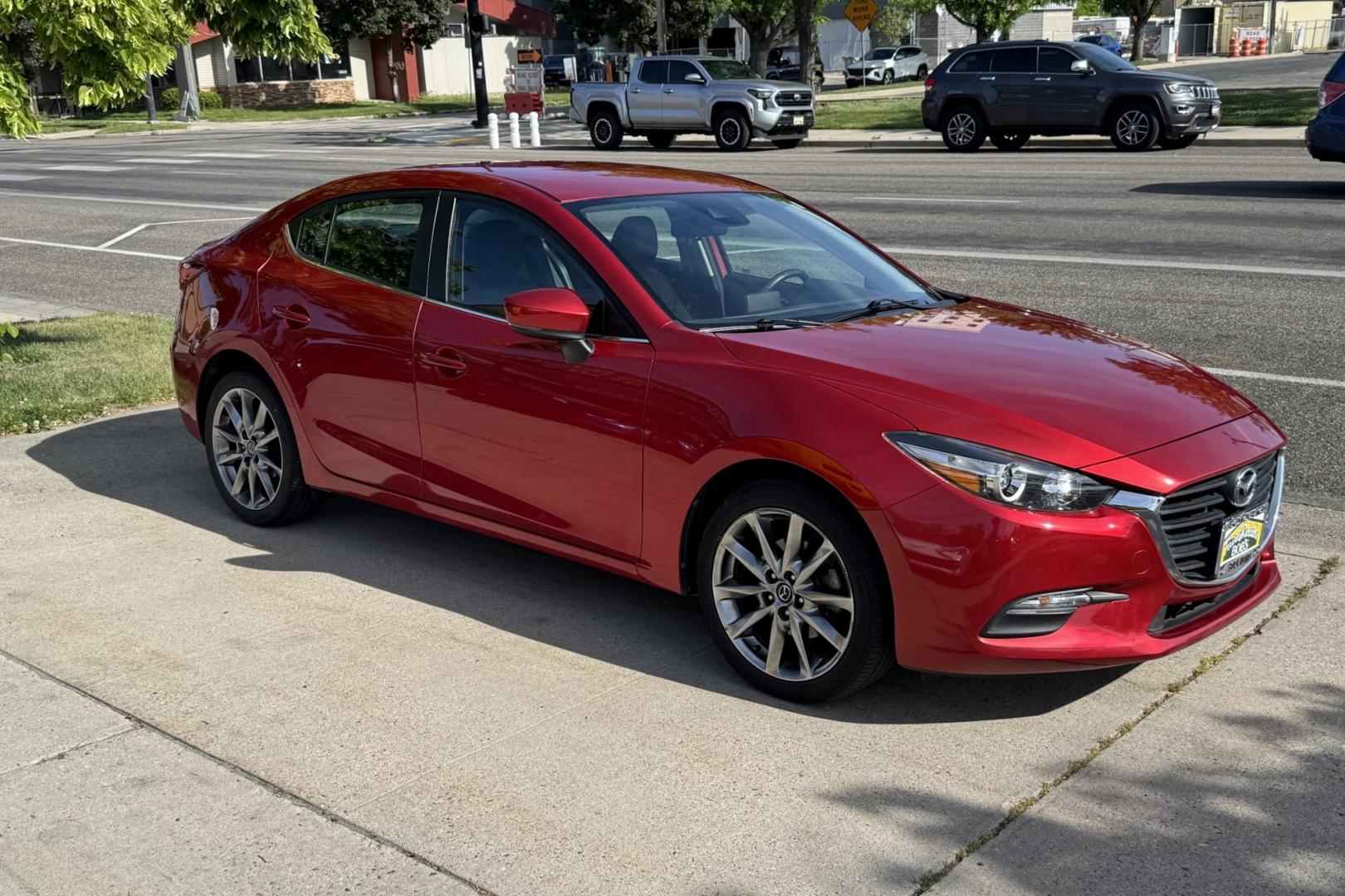 2018 Soul Red /Black Mazda Mazda3 Touring (3MZBN1V32JM) with an 4 Cyl 2.5 liter engine, Automatic 6 Speed transmission, located at 2304 W. Main St., Boise, ID, 83702, (208) 342-7777, 43.622105, -116.218658 - Financing Available O.A.C. - Photo#2