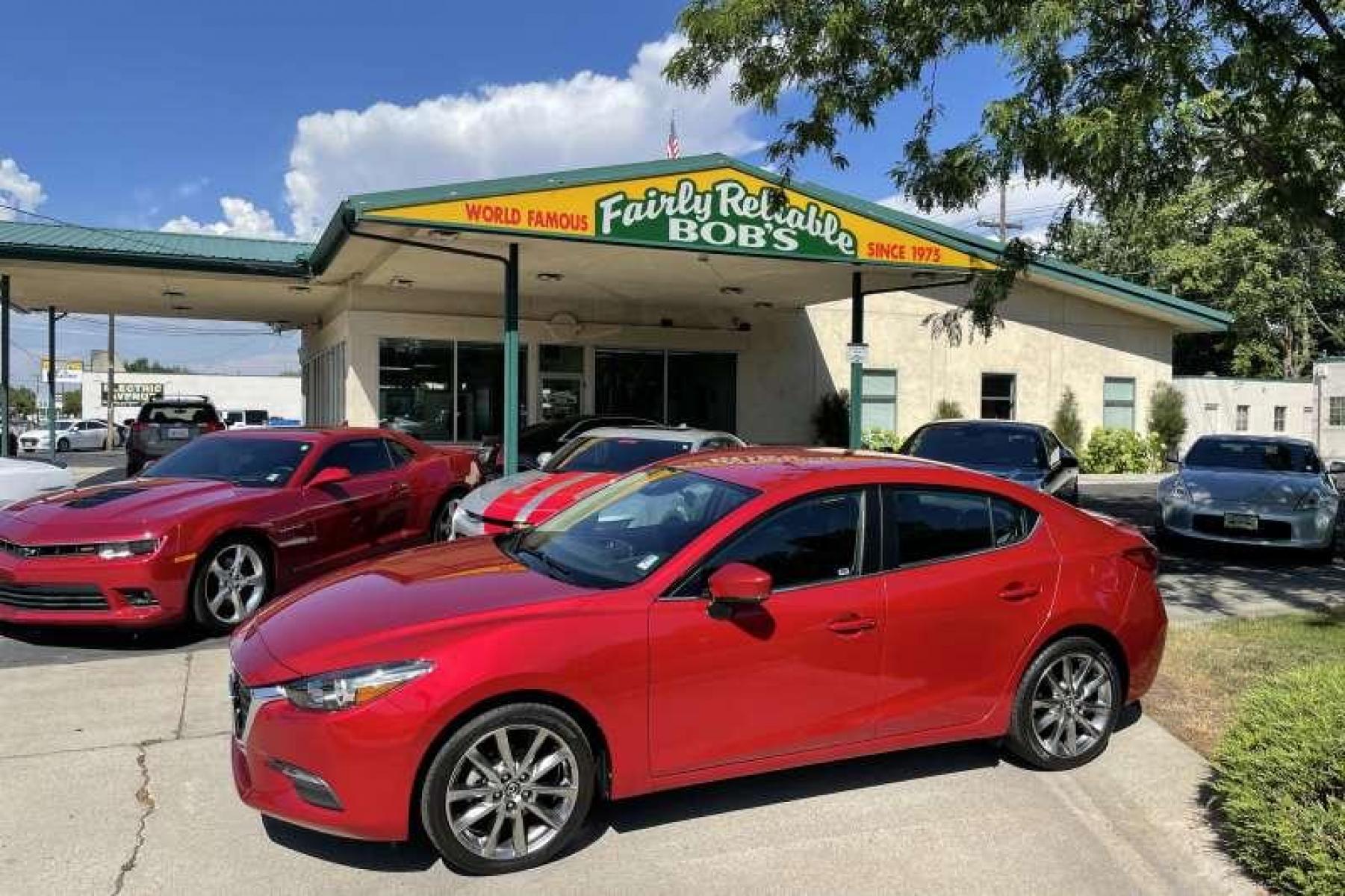 2018 Soul Red /Black Mazda Mazda3 Touring (3MZBN1V32JM) with an 4 Cyl 2.5 liter engine, Automatic transmission, located at 2304 W. Main St., Boise, ID, 83702, (208) 342-7777, 43.622105, -116.218658 - Financing Available O.A.C. - Photo #0