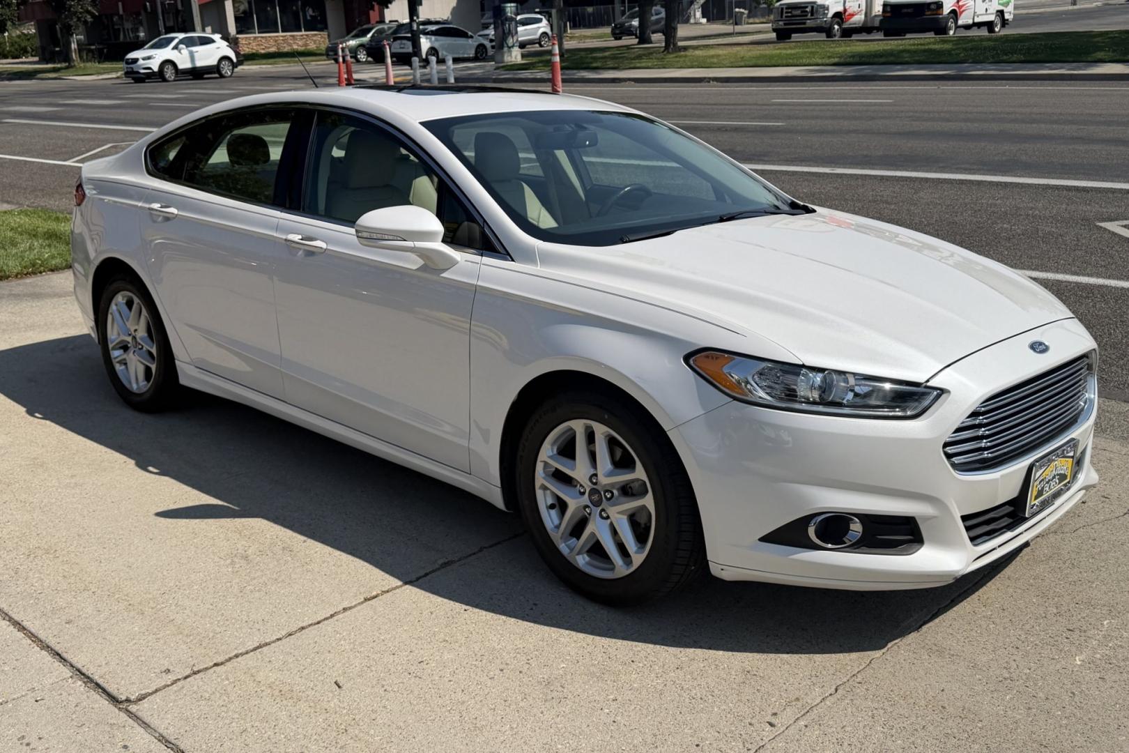 2015 White Platinum /Saddle Ford Fusion SE (3FA6P0HD1FR) with an 4 Cyl 1.5 Liter Turbo engine, Automatic transmission, located at 2304 W. Main St., Boise, ID, 83702, (208) 342-7777, 43.622105, -116.218658 - Well Optioned Fusion! Very Clean, Comfortable And Low Mileage Too!- Photo#2