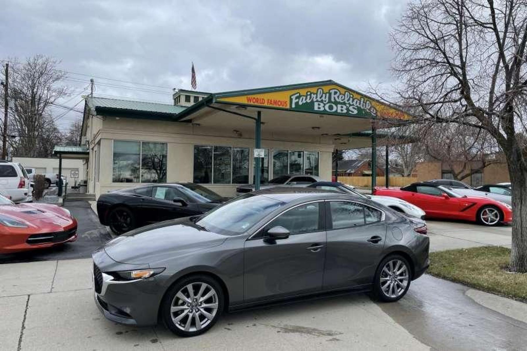 2021 Machine Gray /Black Mazda Mazda3 Select AWD (JM1BPBBL4M1) with an 4 Cyl 2.5 Liter engine, Automatic transmission, located at 2304 W. Main St., Boise, ID, 83702, (208) 342-7777, 43.622105, -116.218658 - Remaining Factory Warranty and All Wheel Drive! - Photo #0