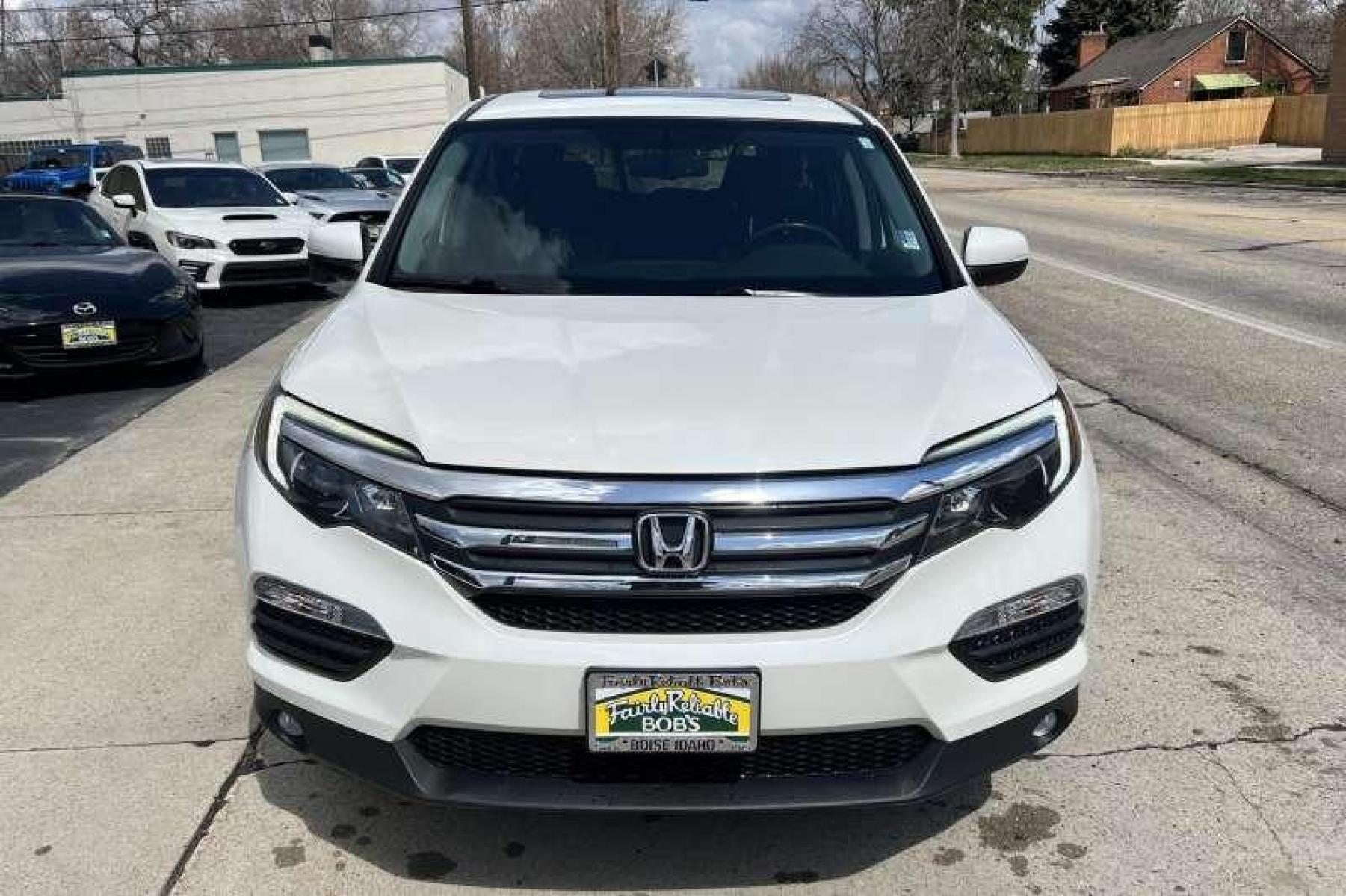 2017 White Diamond Pearl /Black Honda Pilot EX-L (5FNYF6H53HB) with an V6 3.5 Liter engine, Automatic transmission, located at 2304 W. Main St., Boise, ID, 83702, (208) 342-7777, 43.622105, -116.218658 - Local Boise Dealership! Ready to Go! - Photo #1