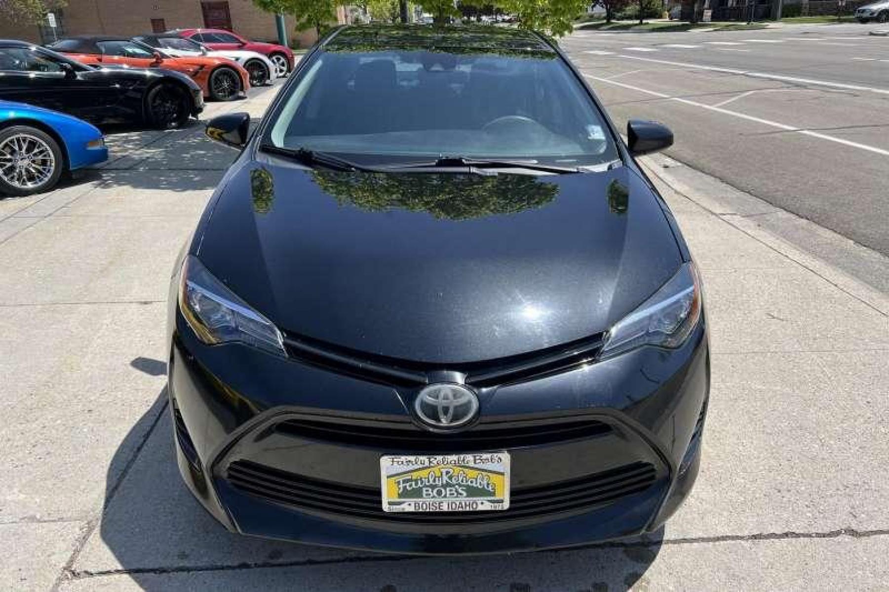 2017 Black Sand Pearl /Black Toyota Corolla LE (5YFBURHE0HP) with an 4 Cyl 1.8 Liter engine, Automatic transmission, located at 2304 W. Main St., Boise, ID, 83702, (208) 342-7777, 43.622105, -116.218658 - Financing Available O.A.C. - Photo #1
