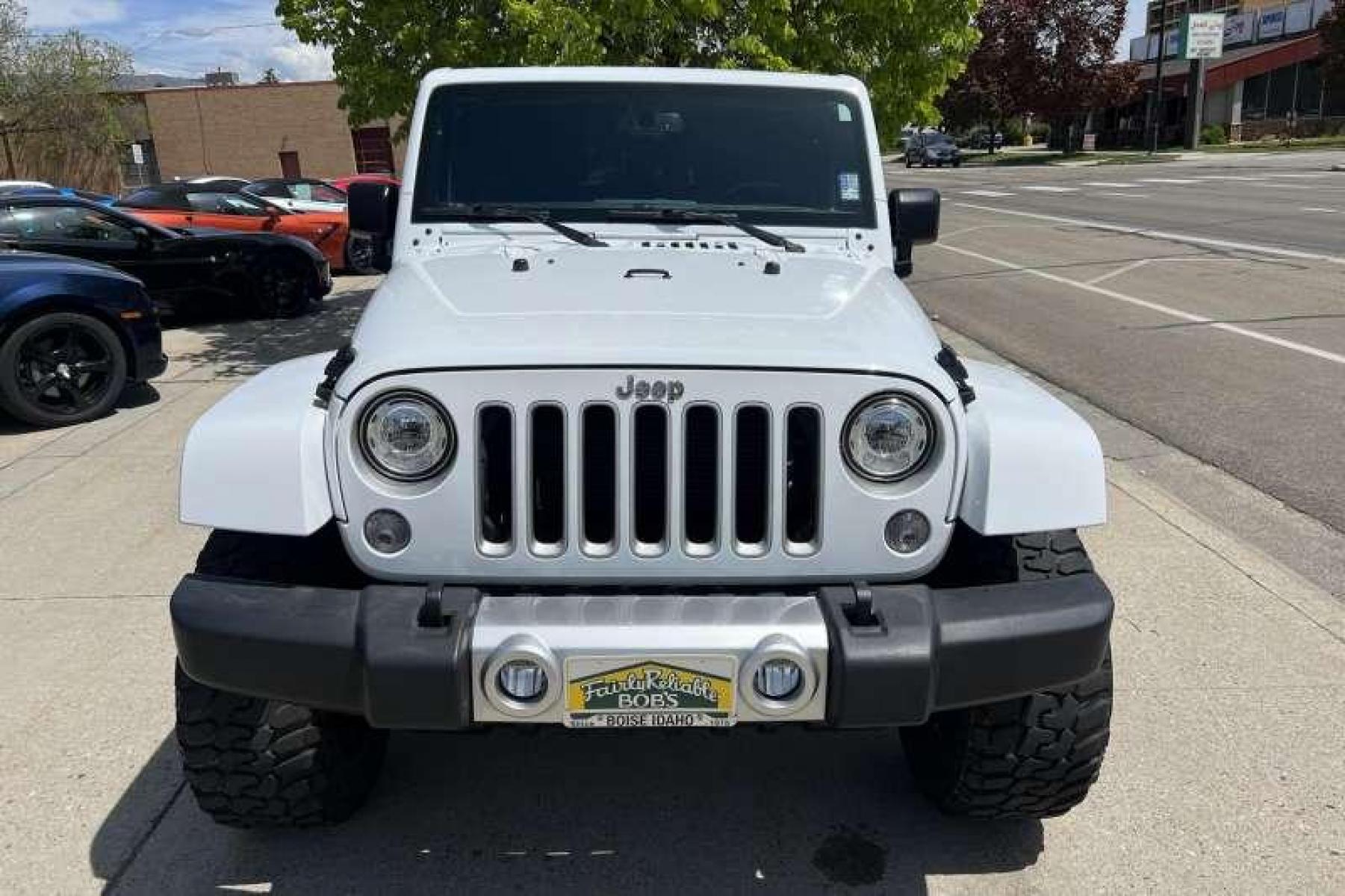 2017 Bright White /Black Jeep Wrangler Unlimited Sahara (1C4BJWEG7HL) with an V6 3.6 Liter engine, Automatic transmission, located at 2304 W. Main St., Boise, ID, 83702, (208) 342-7777, 43.622105, -116.218658 - Ready for adventure! - Photo #1