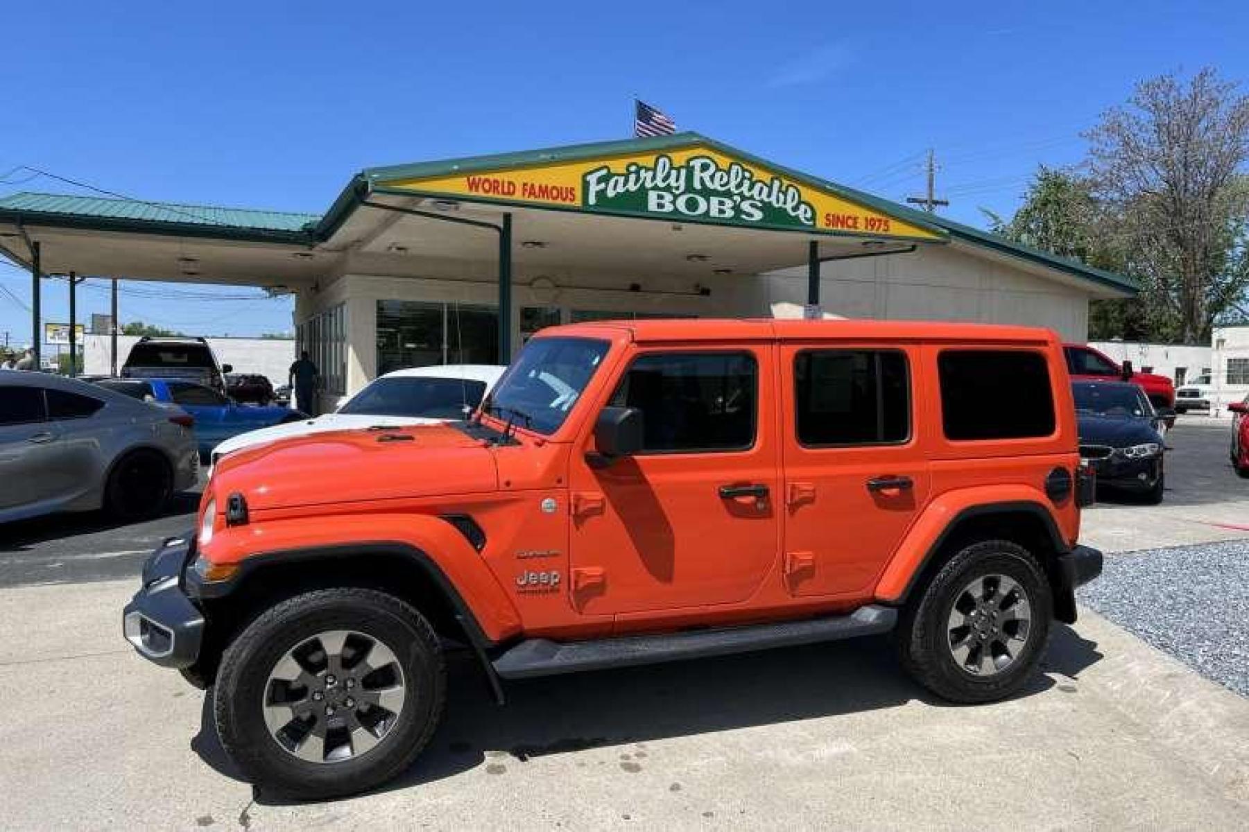 2019 Punkn Metallic Orange /Black Jeep Wrangler Unlimited Sahara (1C4HJXEG8KW) with an V6 3.6 Liter engine, Automatic transmission, located at 2304 W. Main St., Boise, ID, 83702, (208) 342-7777, 43.622105, -116.218658 - Great color! Low miles! - Photo #0