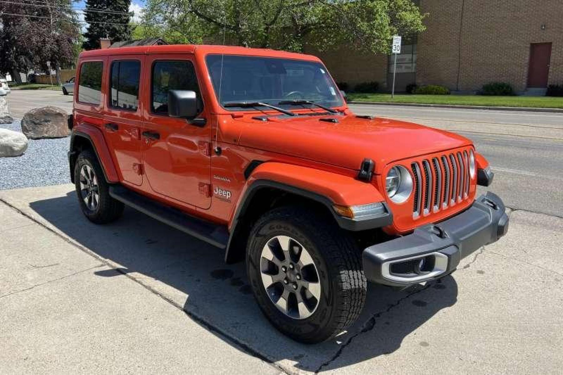 2019 Punkn Metallic Orange /Black Jeep Wrangler Unlimited Sahara (1C4HJXEG8KW) with an V6 3.6 Liter engine, Automatic transmission, located at 2304 W. Main St., Boise, ID, 83702, (208) 342-7777, 43.622105, -116.218658 - Great color! Low miles! - Photo #2