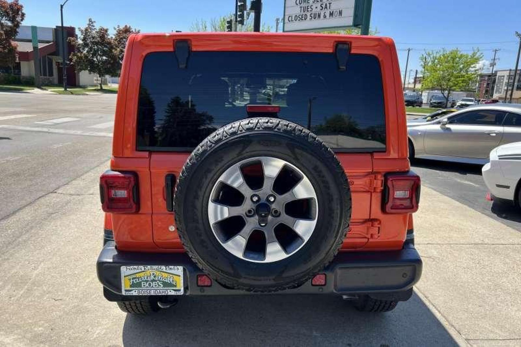 2019 Punkn Metallic Orange /Black Jeep Wrangler Unlimited Sahara (1C4HJXEG8KW) with an V6 3.6 Liter engine, Automatic transmission, located at 2304 W. Main St., Boise, ID, 83702, (208) 342-7777, 43.622105, -116.218658 - Great color! Low miles! - Photo #3
