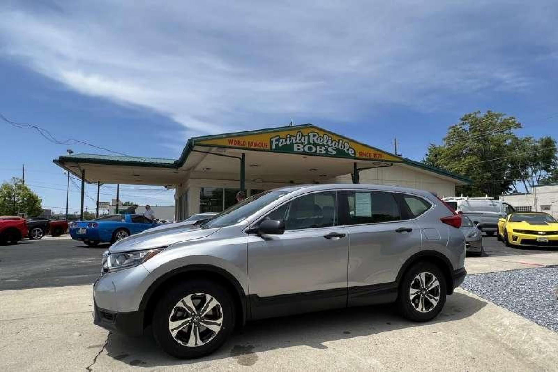 2018 Lunar Silver Metallic /Gray Honda CR-V LX (2HKRW6H3XJH) with an 4 Cyl 2.4 Liter engine, Automatic transmission, located at 2304 W. Main St., Boise, ID, 83702, (208) 342-7777, 43.622105, -116.218658 - All Wheel Drive! New Tires! - Photo #0