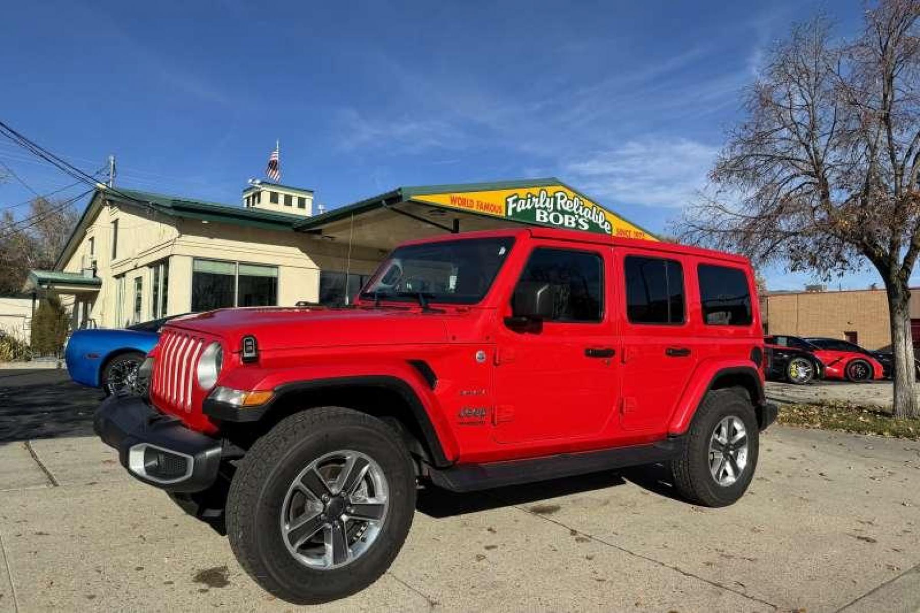 2021 Red /Black Jeep Wrangler Unlimited Sahara (1C4HJXEN1MW) with an 4 Cyl 2.0 Liter Turbo engine, Automatic transmission, located at 2304 W. Main St., Boise, ID, 83702, (208) 342-7777, 43.622105, -116.218658 - Financing Available O.A.C. - Photo #0