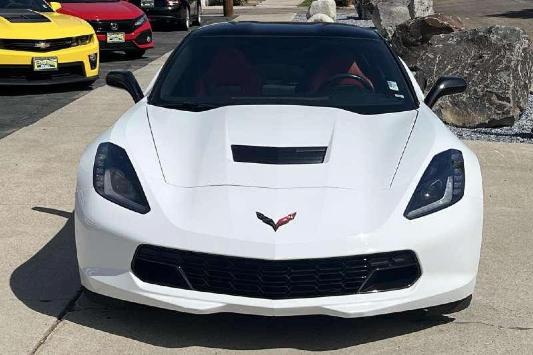 2015 Arctic White /Red Chevrolet Corvette Stingray Z51 Coupe (1G1YG2D74F5) with an V8 6.2 Liter engine, Manual transmission, located at 2304 W. Main St., Boise, ID, 83702, (208) 342-7777, 43.622105, -116.218658 - 7-Speed Manual! Low miles! - Photo #1