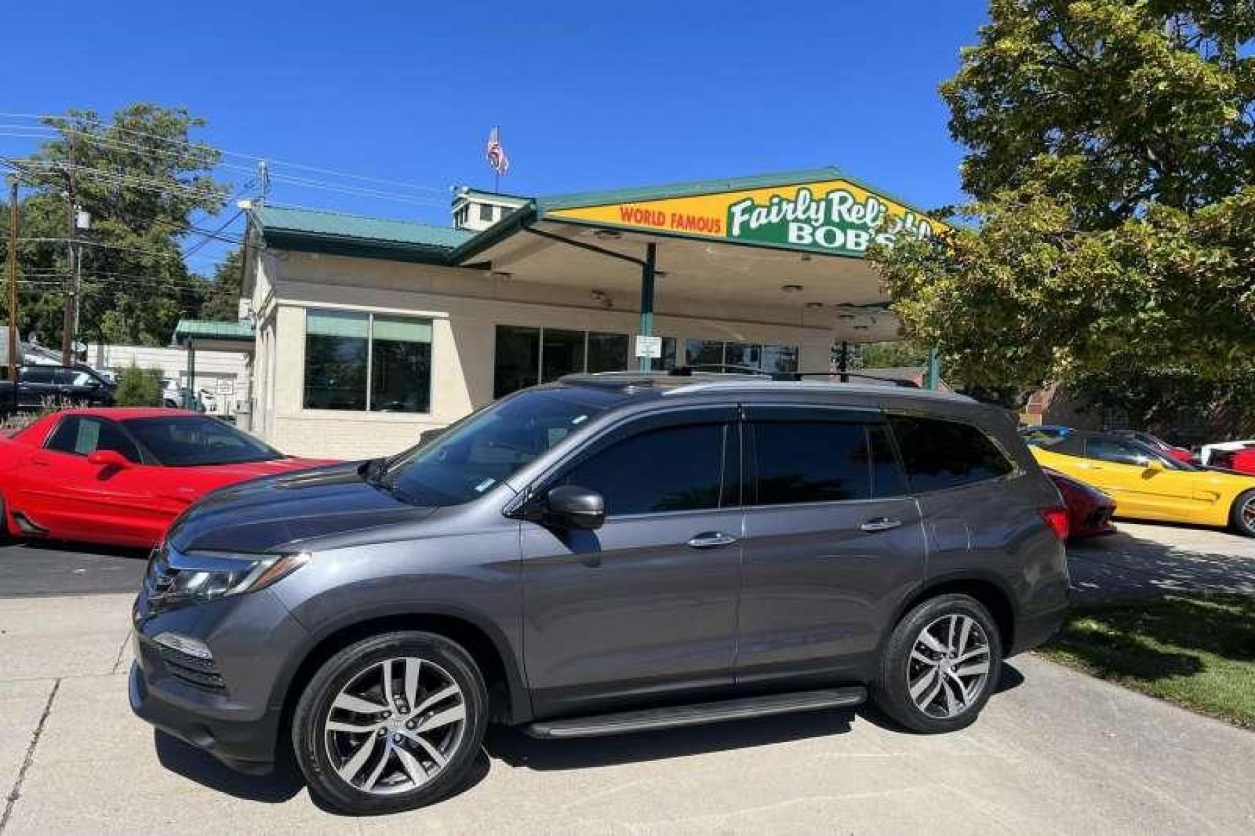 2016 Modern Steel Metallic /Gray Honda Pilot Elite 4WD (5FNYF6H04GB) with an 3.5L V6 engine, Automatic transmission, located at 2304 W. Main St., Boise, ID, 83702, (208) 342-7777, 43.622105, -116.218658 - Heated and Ventilated Seats! Blu Ray Entertainment! - Photo #0