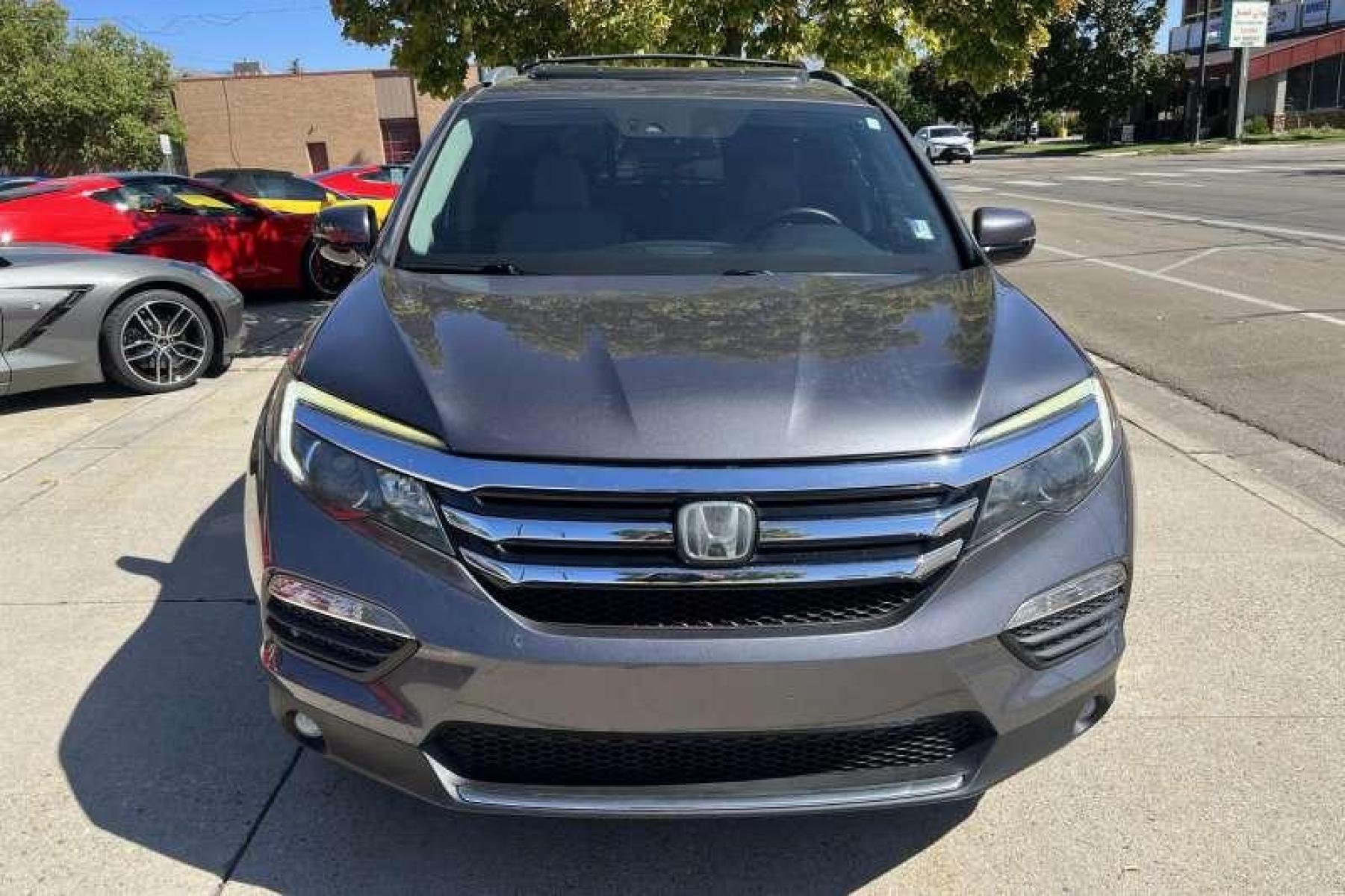 2016 Modern Steel Metallic /Gray Honda Pilot Elite 4WD (5FNYF6H04GB) with an 3.5L V6 engine, Automatic transmission, located at 2304 W. Main St., Boise, ID, 83702, (208) 342-7777, 43.622105, -116.218658 - Heated and Ventilated Seats! Blu Ray Entertainment! - Photo #1
