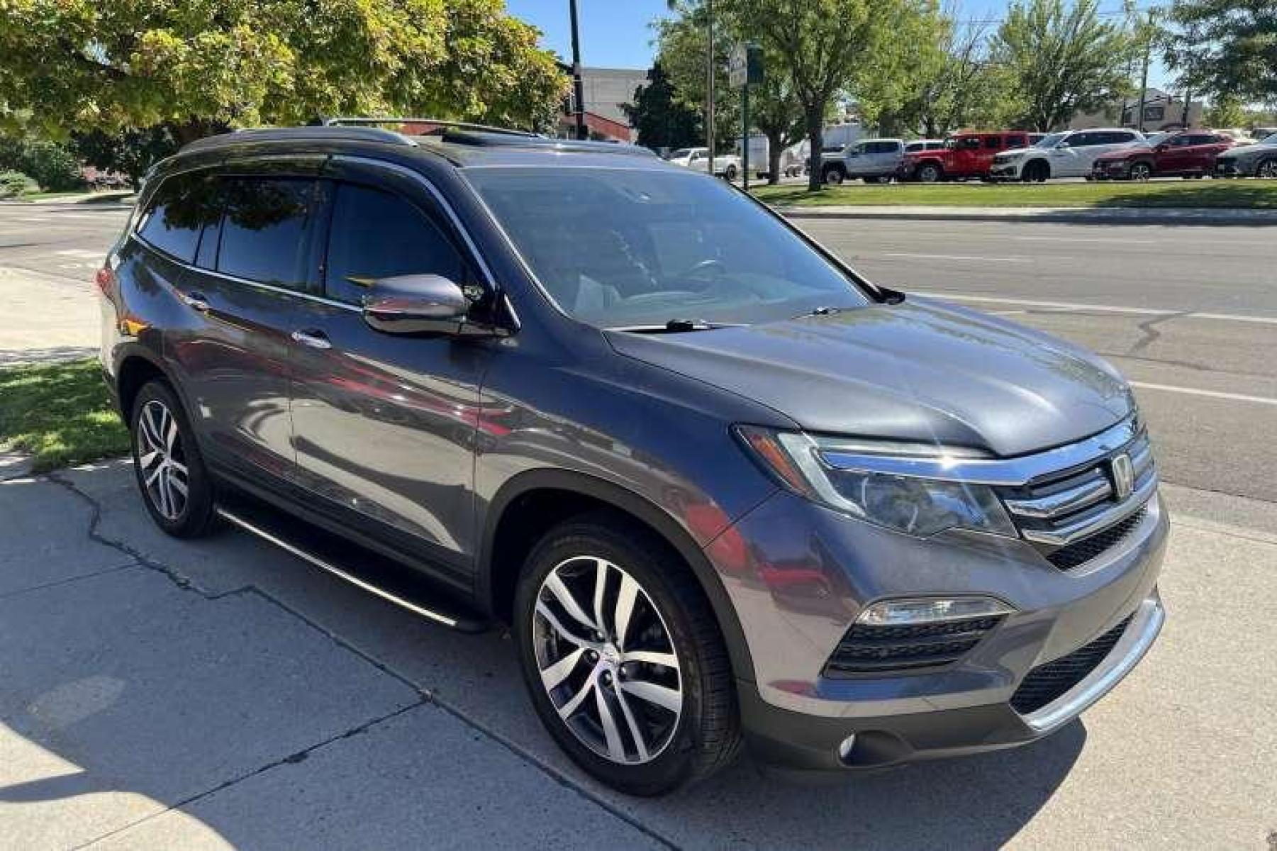 2016 Modern Steel Metallic /Gray Honda Pilot Elite 4WD (5FNYF6H04GB) with an 3.5L V6 engine, Automatic transmission, located at 2304 W. Main St., Boise, ID, 83702, (208) 342-7777, 43.622105, -116.218658 - Heated and Ventilated Seats! Blu Ray Entertainment! - Photo #2