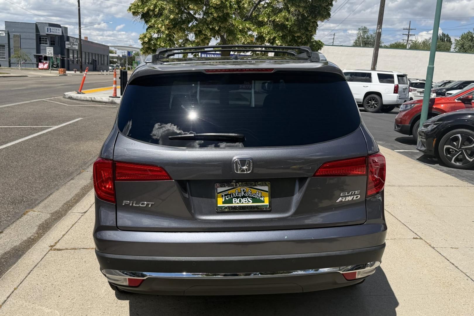 2016 Modern Steel Metallic /Gray Honda Pilot Elite (5FNYF6H04GB) with an V6 3.5 Liter engine, Automatic 9 Speed transmission, located at 2304 W. Main St., Boise, ID, 83702, (208) 342-7777, 43.622105, -116.218658 - Highly Optioned With Safety Features! Heated and Ventilated Seats! Blu Ray Entertainment!- Photo#1