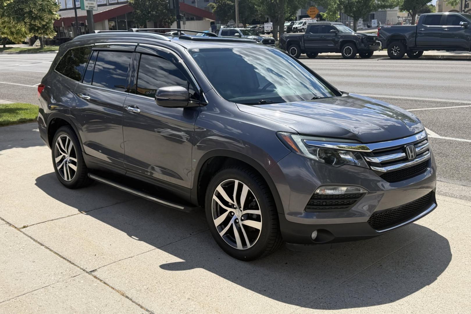 2016 Modern Steel Metallic /Gray Honda Pilot Elite (5FNYF6H04GB) with an V6 3.5 Liter engine, Automatic 9 Speed transmission, located at 2304 W. Main St., Boise, ID, 83702, (208) 342-7777, 43.622105, -116.218658 - Highly Optioned With Safety Features! Heated and Ventilated Seats! Blu Ray Entertainment!- Photo#2