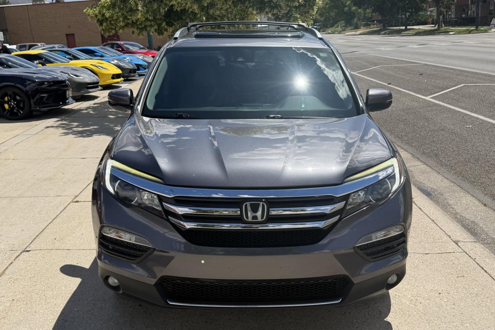 2016 Modern Steel Metallic /Gray Honda Pilot Elite (5FNYF6H04GB) with an V6 3.5 Liter engine, Automatic 9 Speed transmission, located at 2304 W. Main St., Boise, ID, 83702, (208) 342-7777, 43.622105, -116.218658 - Highly Optioned With Safety Features! Heated and Ventilated Seats! Blu Ray Entertainment!- Photo#3