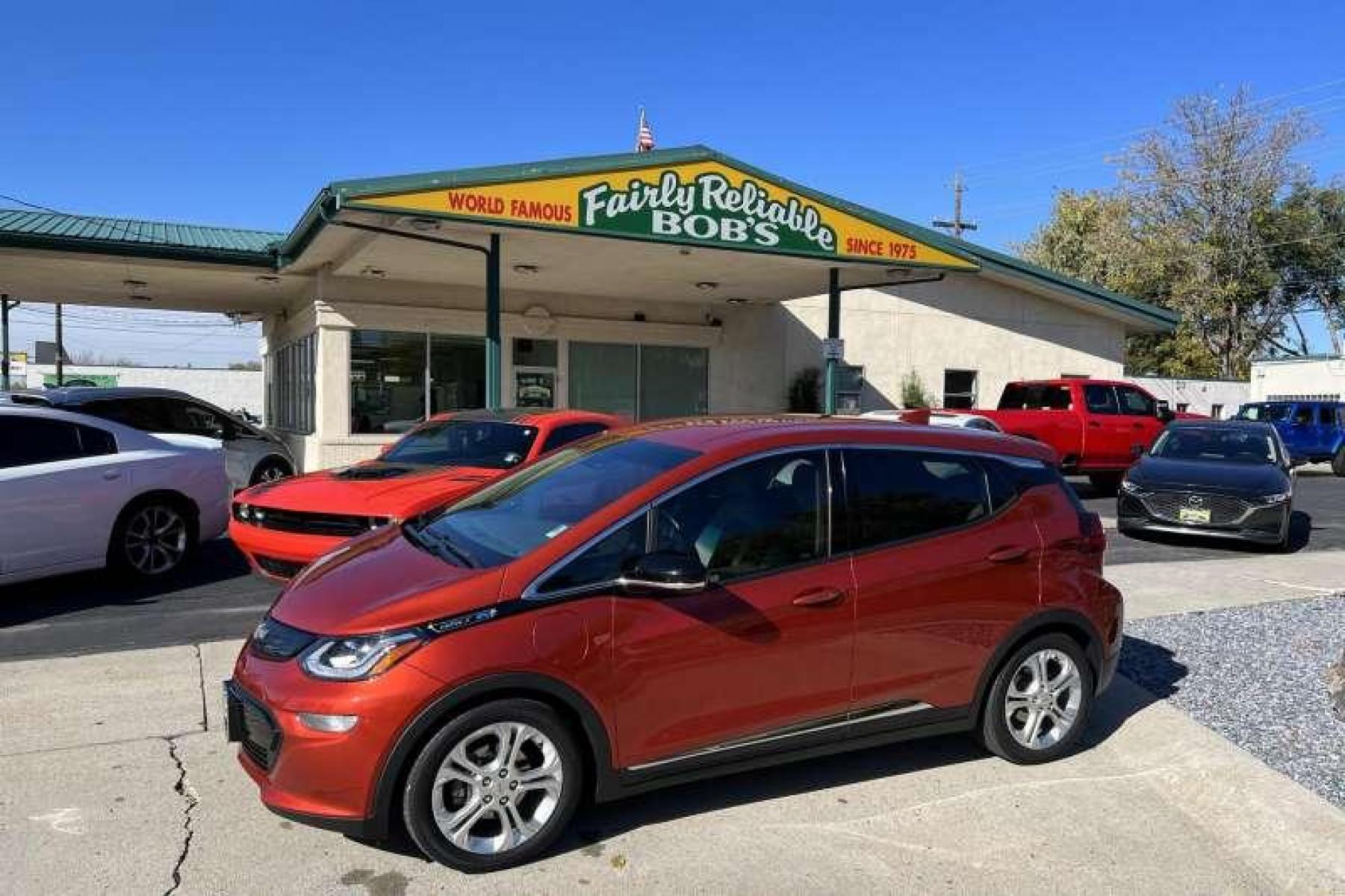 2020 Cayenne Orange Metallic /Dark Galvanized/Sky Cool Gray Chevrolet Bolt LT (1G1FY6S07L4) with an EV engine, Automatic transmission, located at 2304 W. Main St., Boise, ID, 83702, (208) 342-7777, 43.622105, -116.218658 - Great color! No more gas! - Photo #0