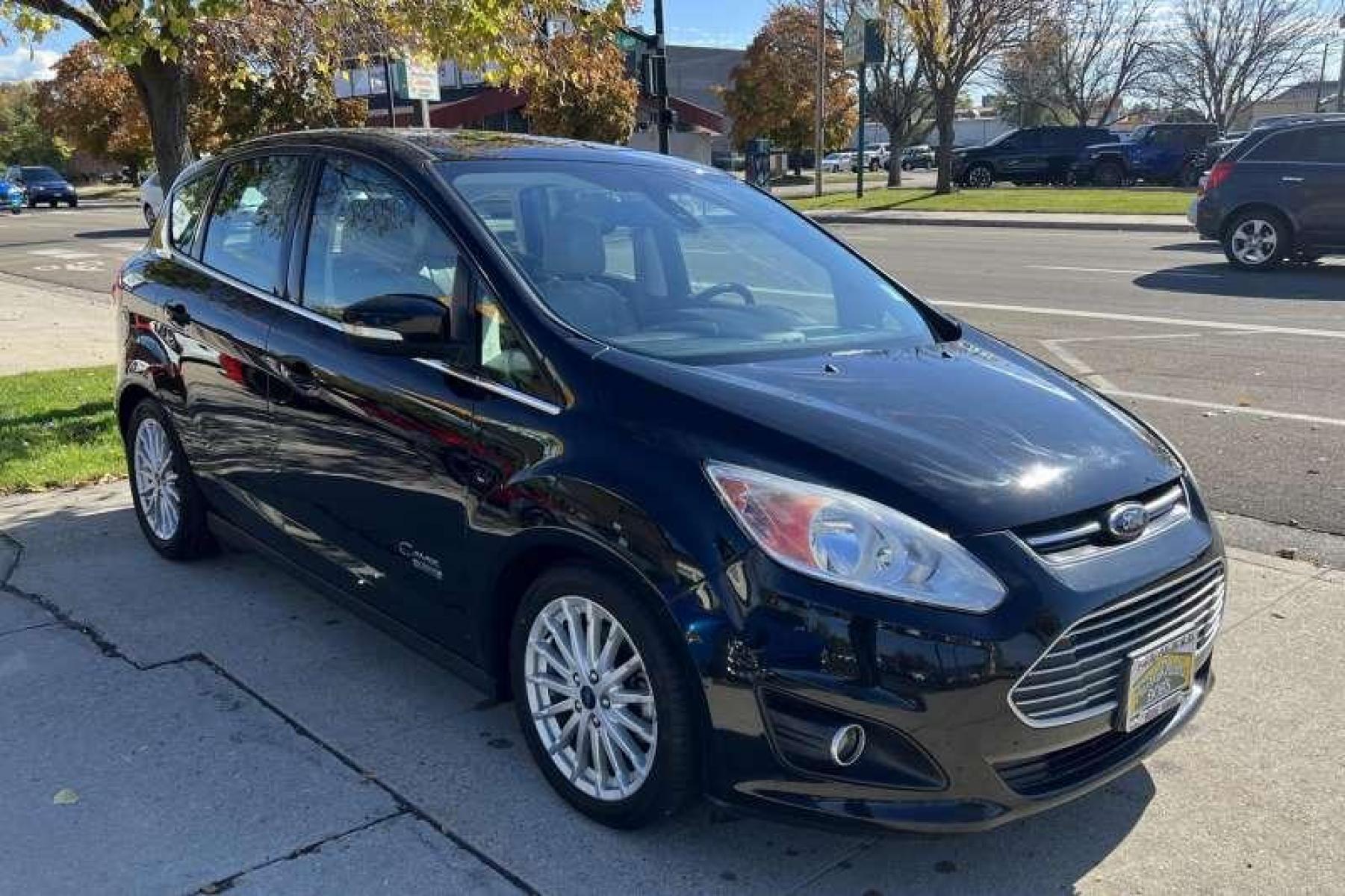 2016 Black /Tan Ford C-Max Energi Hatchback SEL (1FADP5CU9GL) with an 4 Cyl 2.0 Liter Hybrid engine, Automatic transmission, located at 2304 W. Main St., Boise, ID, 83702, (208) 342-7777, 43.622105, -116.218658 - Recharging on the run lets the C-Max Energi's power management system regularly deliver short bursts of all-electric travel, which can stretch overall fuel economy to nearly 90 MPGe. Operating only in standard hybrid mode when the initial battery charge is depleted, the C-Max Energi delivers up to 3 - Photo #2