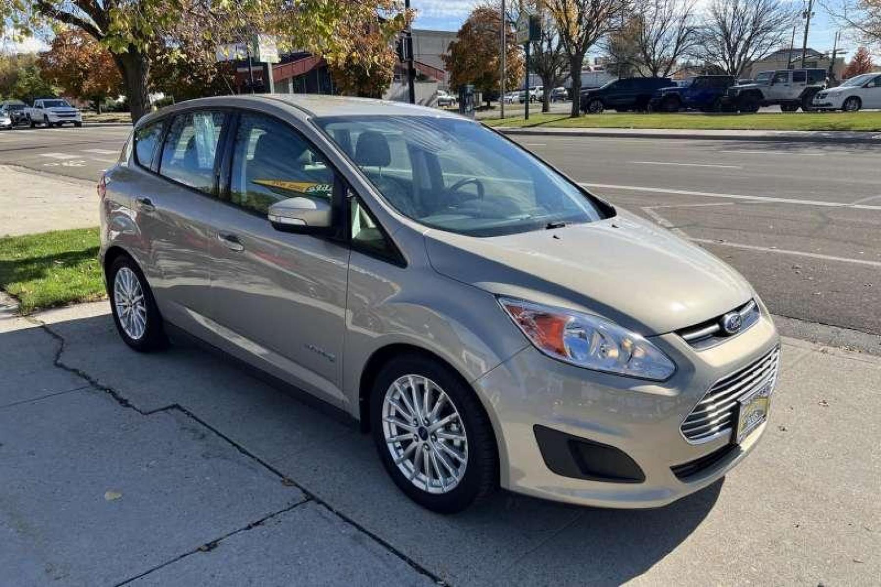 2015 Tectonic Silver /Tan Ford C-Max Hybrid SE Hatchback (1FADP5AU9FL) with an 4 Cyl 2.0 Liter Hybrid engine, Automatic transmission, located at 2304 W. Main St., Boise, ID, 83702, (208) 342-7777, 43.622105, -116.218658 - Photo #1