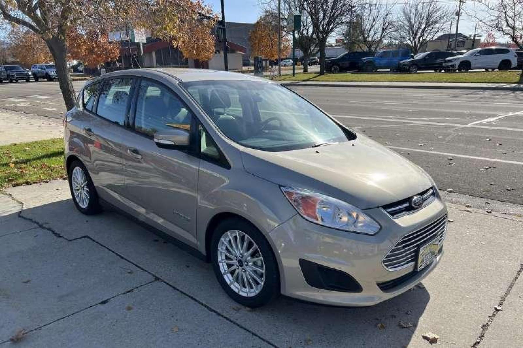 2015 Tectonic Silver /Tan Ford C-Max Hybrid SE Hatchback (1FADP5AUXFL) with an 4 Cyl 2.0 Liter Hybrid engine, Automatic transmission, located at 2304 W. Main St., Boise, ID, 83702, (208) 342-7777, 43.622105, -116.218658 - Photo #2