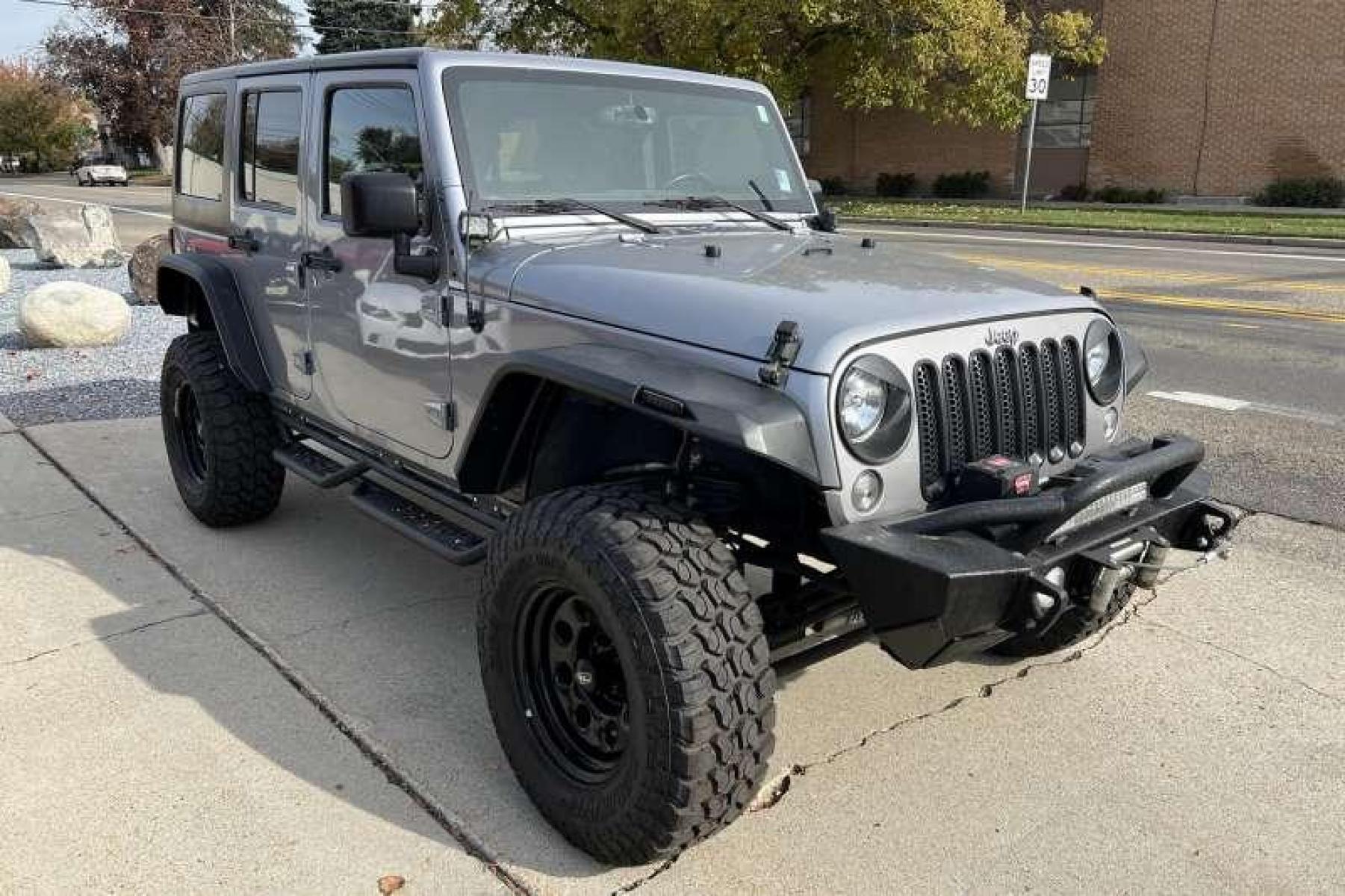 2016 Billet Silver /Black Jeep Wrangler Unlimited Sahara (1C4BJWEG4GL) with an V6 3.6 Liter engine, Automatic transmission, located at 2304 W. Main St., Boise, ID, 83702, (208) 342-7777, 43.622105, -116.218658 - Photo #2