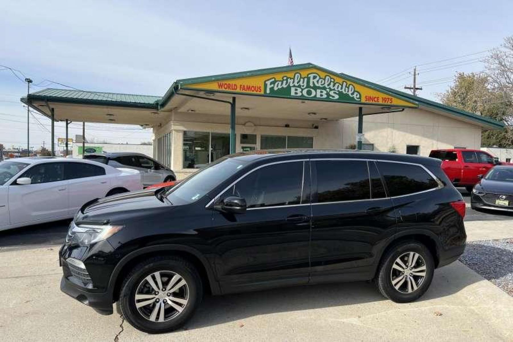 2017 Black /Black Honda Pilot EX-L w/Honda Sensing (5FNYF6H60HB) with an V6 3.5 Liter engine, Automatic transmission, located at 2304 W. Main St., Boise, ID, 83702, (208) 342-7777, 43.622105, -116.218658 - Great Family Vehicle!Honda Sensing package adds adaptive cruise control, forward collision mitigation with automatic braking, a road departure intervention system, a forward collision warning system, and lane departure warning and intervention systems. - Photo #0