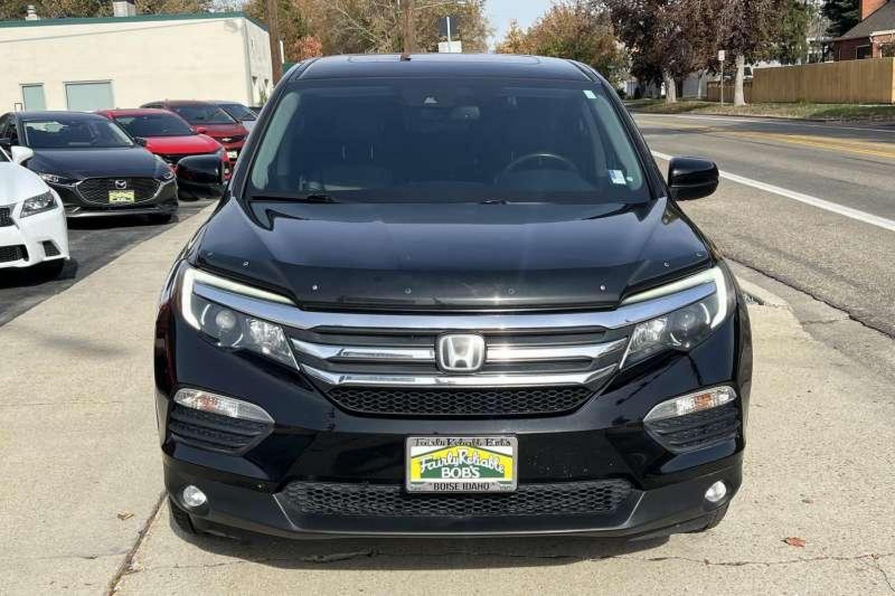 2017 Black /Black Honda Pilot EX-L w/Honda Sensing (5FNYF6H60HB) with an V6 3.5 Liter engine, Automatic transmission, located at 2304 W. Main St., Boise, ID, 83702, (208) 342-7777, 43.622105, -116.218658 - Great Family Vehicle!Honda Sensing package adds adaptive cruise control, forward collision mitigation with automatic braking, a road departure intervention system, a forward collision warning system, and lane departure warning and intervention systems. - Photo #1