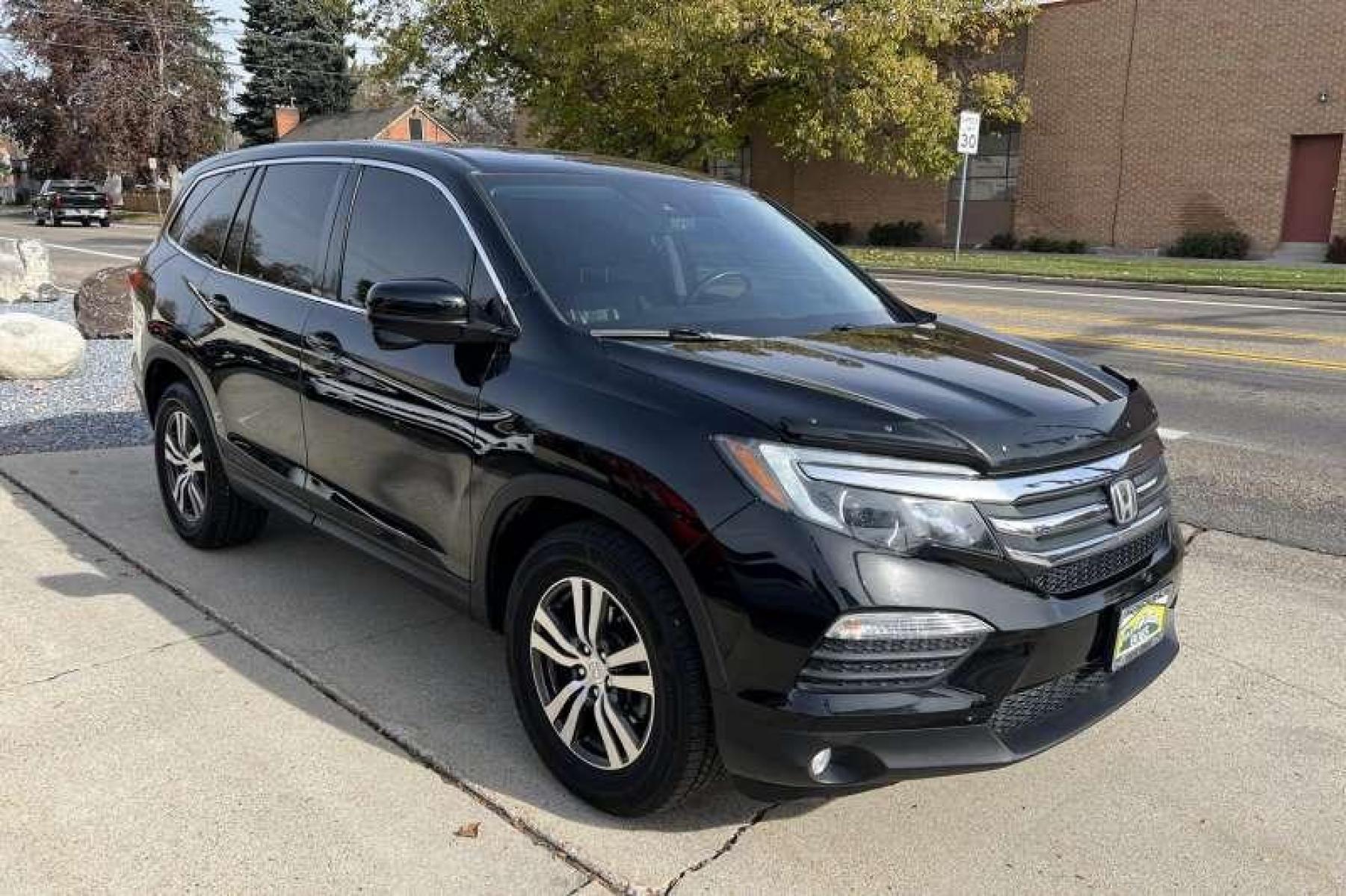 2017 Black /Black Honda Pilot EX-L w/Honda Sensing (5FNYF6H60HB) with an V6 3.5 Liter engine, Automatic transmission, located at 2304 W. Main St., Boise, ID, 83702, (208) 342-7777, 43.622105, -116.218658 - Great Family Vehicle!Honda Sensing package adds adaptive cruise control, forward collision mitigation with automatic braking, a road departure intervention system, a forward collision warning system, and lane departure warning and intervention systems. - Photo #2