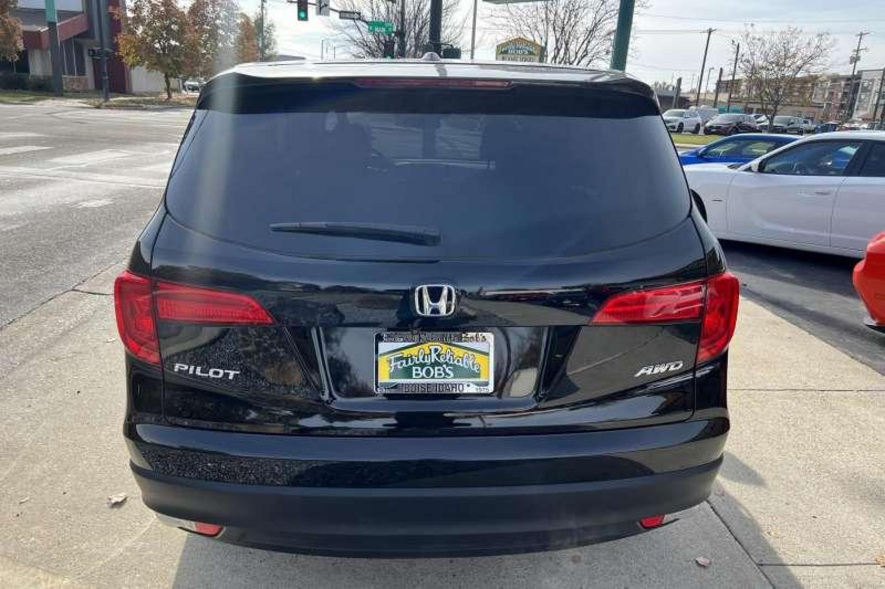 2017 Black /Black Honda Pilot EX-L w/Honda Sensing (5FNYF6H60HB) with an V6 3.5 Liter engine, Automatic transmission, located at 2304 W. Main St., Boise, ID, 83702, (208) 342-7777, 43.622105, -116.218658 - Great Family Vehicle!Honda Sensing package adds adaptive cruise control, forward collision mitigation with automatic braking, a road departure intervention system, a forward collision warning system, and lane departure warning and intervention systems. - Photo #3