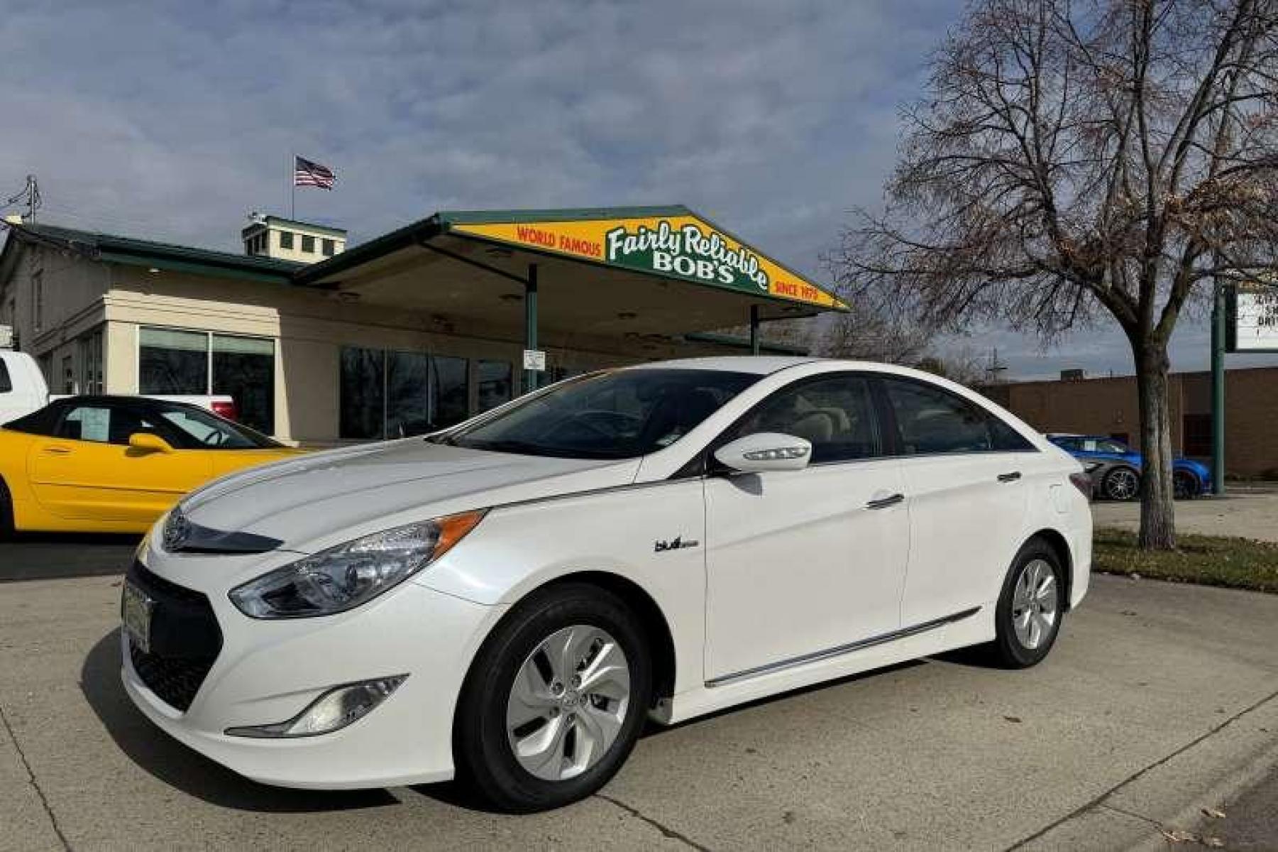 2015 Quartz White Pearl Hyundai Sonata Hybrid (KMHEC4A49FA) with an 4 Cyl 2.4 Liter Hybrid engine, Automatic transmission, located at 2304 W. Main St., Boise, ID, 83702, (208) 342-7777, 43.622105, -116.218658 - New Tires! 35 MPG City and 38 Highway! Smooth Ride Too! - Photo #0