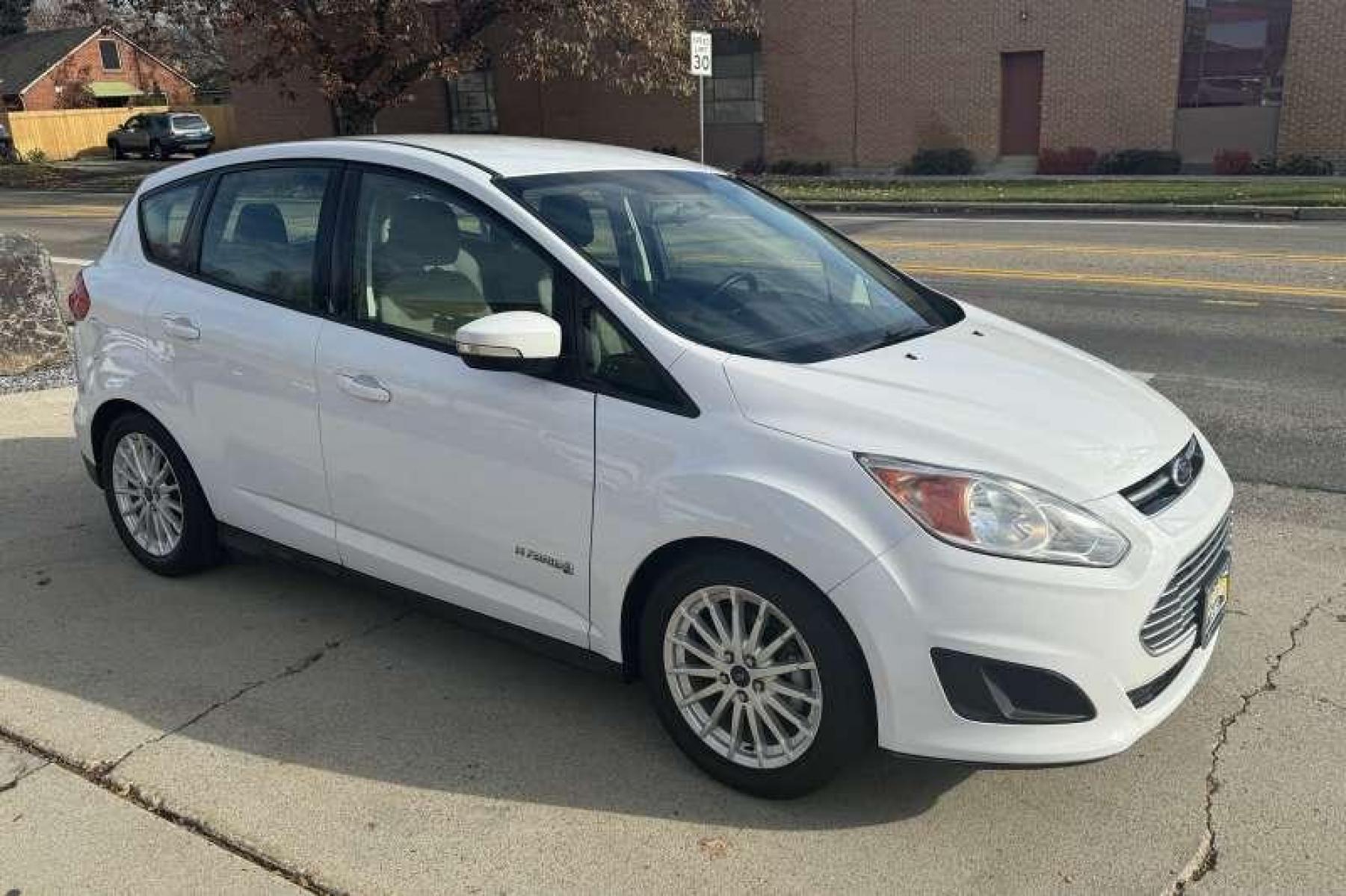 2014 Oxford White /Stone Ford C-Max Hybrid SE Hatchback (1FADP5AU8EL) with an 4 Cyl 2.0 Liter Hybrid engine, Automatic transmission, located at 2304 W. Main St., Boise, ID, 83702, (208) 342-7777, 43.622105, -116.218658 - Low Mileage and 36 MPG Highway and Over 40 City! Financing Available O.A.C. - Photo #3