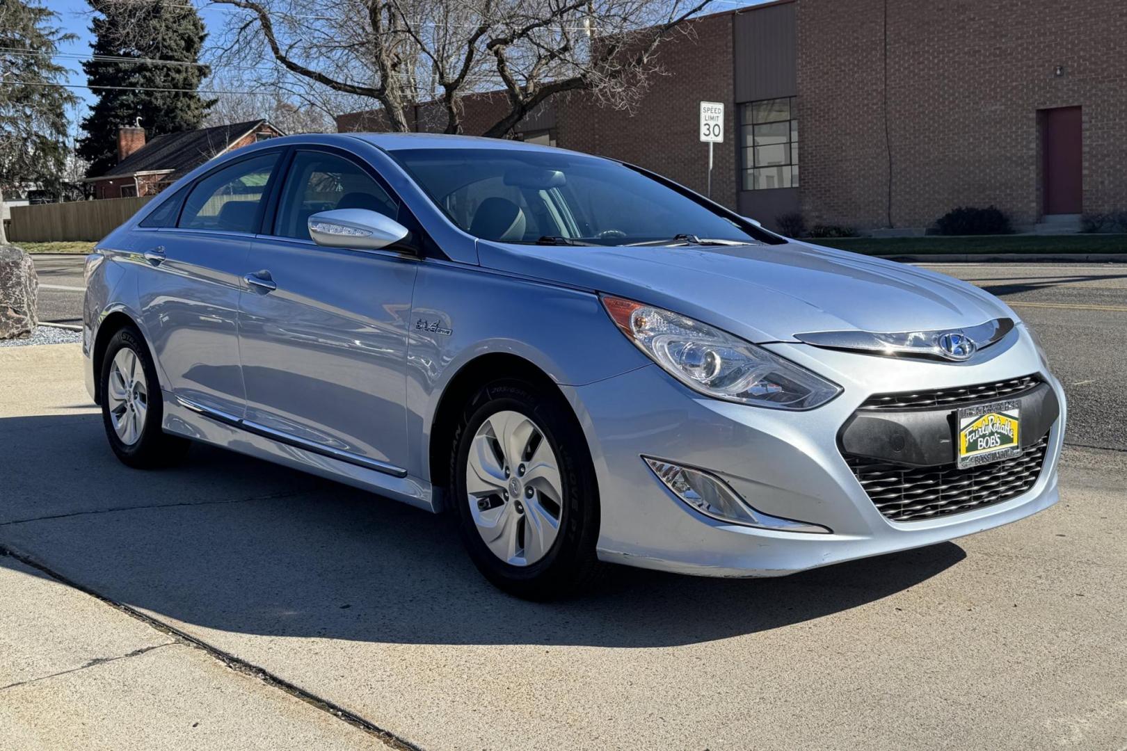 2015 Marlin Blue /Gray Hyundai Sonata Hybrid (KMHEC4A47FA) with an 4 Cyl 2.4 Liter Hybrid engine, Automatic transmission, located at 2304 W. Main St., Boise, ID, 83702, (208) 342-7777, 43.622105, -116.218658 - 35 MPG City and 38 Highway! Smooth Ride Too! - Photo#2