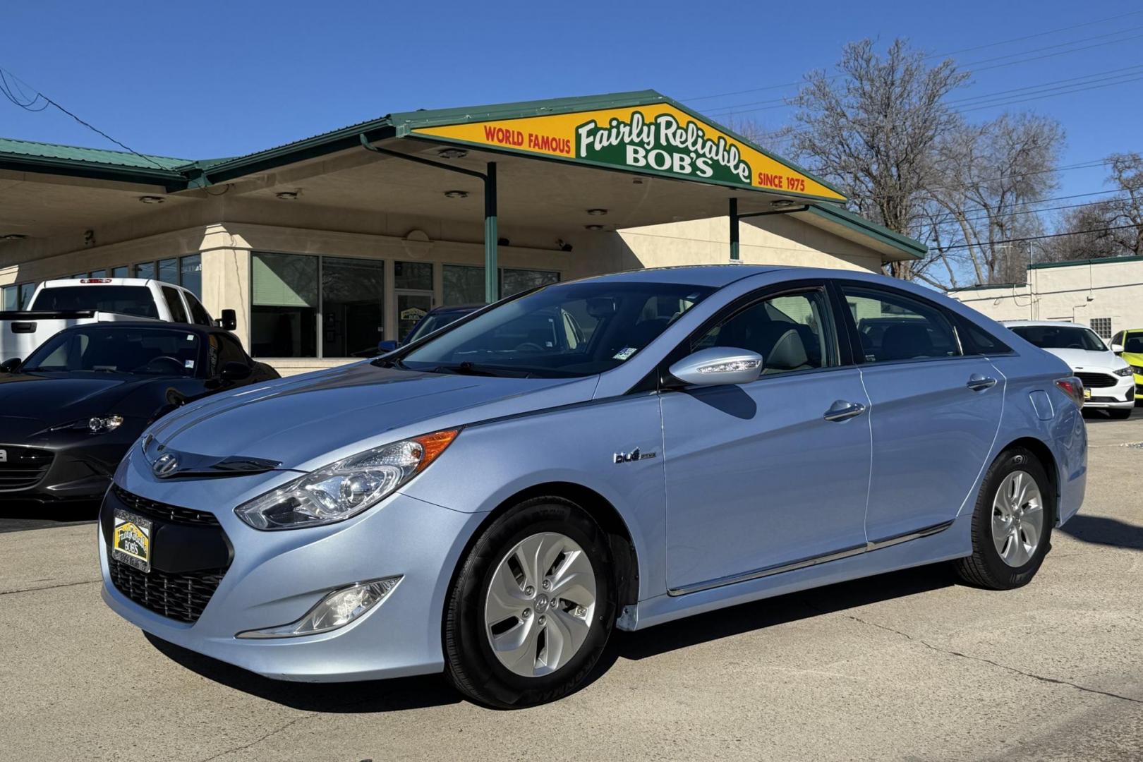 2015 Marlin Blue /Gray Hyundai Sonata Hybrid (KMHEC4A47FA) with an 4 Cyl 2.4 Liter Hybrid engine, Automatic transmission, located at 2304 W. Main St., Boise, ID, 83702, (208) 342-7777, 43.622105, -116.218658 - 35 MPG City and 38 Highway! Smooth Ride Too! - Photo#0