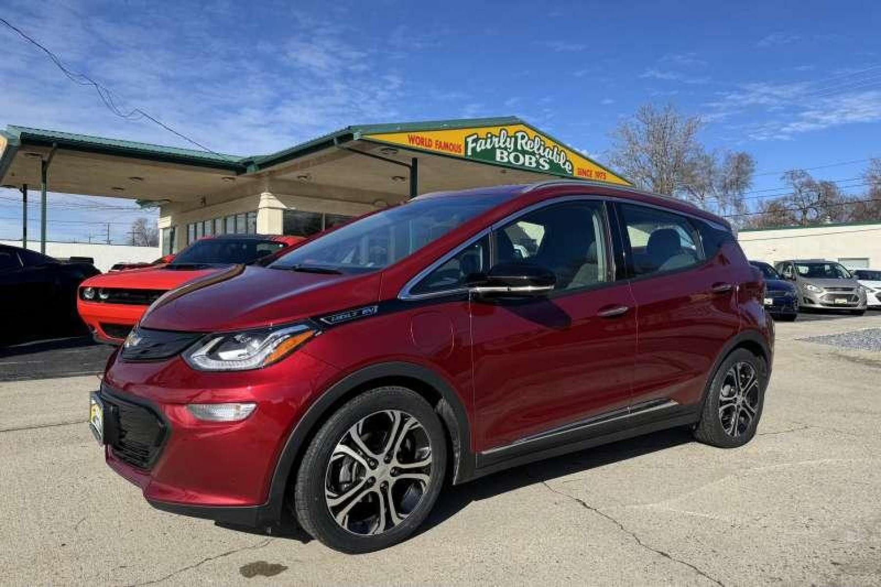 2020 Cajun Red /Dark Galvanized Gray Chevrolet Bolt Premier (1G1FZ6S06L4) with an 66 kWh engine, Automatic transmission, located at 2304 W. Main St., Boise, ID, 83702, (208) 342-7777, 43.622105, -116.218658 - Remaining Factory Warranty! New Tires! Ready To Go! Car Qualifies For The EV Tax Credit! - Photo #0