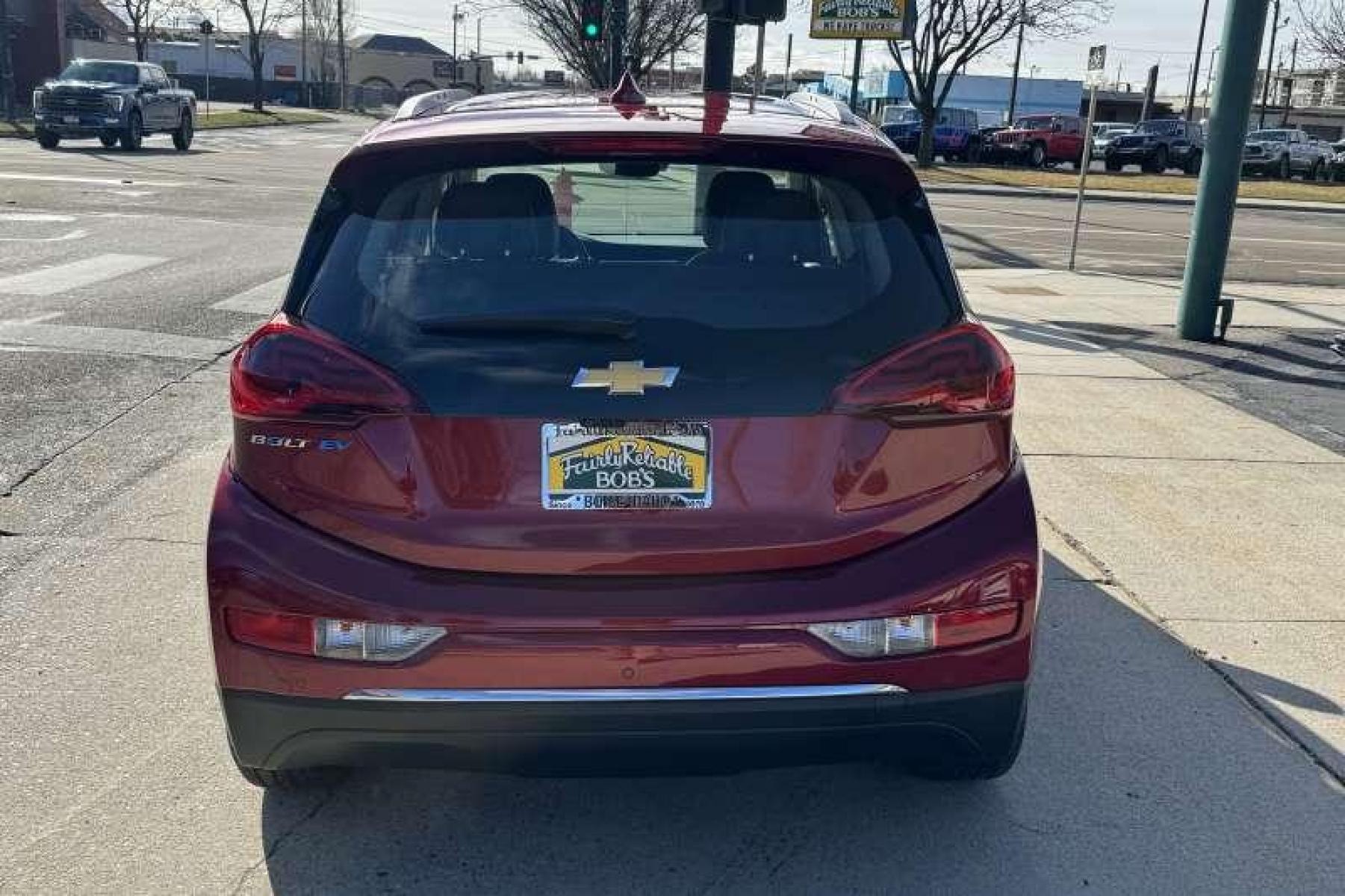 2020 Cajun Red /Dark Galvanized Gray Chevrolet Bolt Premier (1G1FZ6S06L4) with an 66 kWh engine, Automatic transmission, located at 2304 W. Main St., Boise, ID, 83702, (208) 342-7777, 43.622105, -116.218658 - Remaining Factory Warranty! New Tires! Ready To Go! Car Qualifies For The EV Tax Credit! - Photo #1